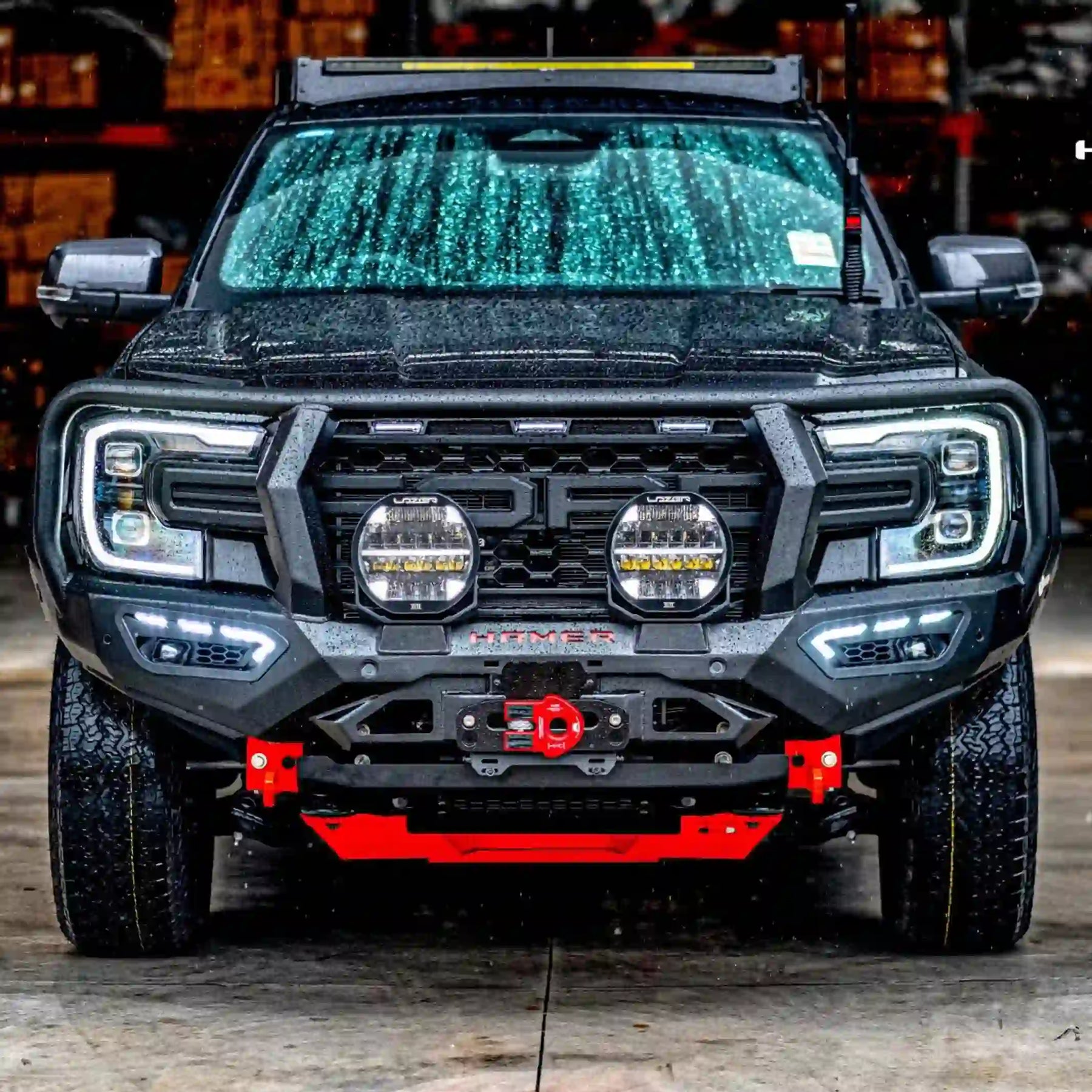 Front installed view of Atlas Series Plus Bull Bar in black on Ford Ranger (2022–Present) by Elevated 4x4 Australia, featuring matte black finish, rated recovery points, and winch-ready design.