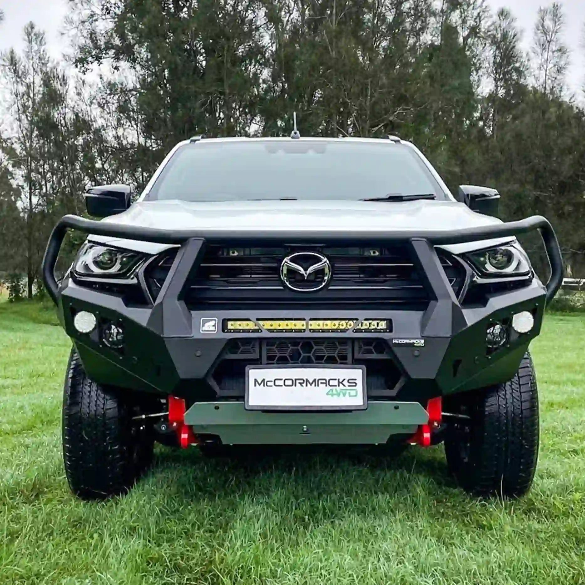 Close-front shot of the Offroad Animal Toro Bull Bar on a Mazda BT-50, showing its matte-black powder-coated finish, LED light bar compatibility, and precision steel build. Professionally fitted by Elevated 4x4, this bar enhances airflow, toughness, and safety for adventure-ready Australians.