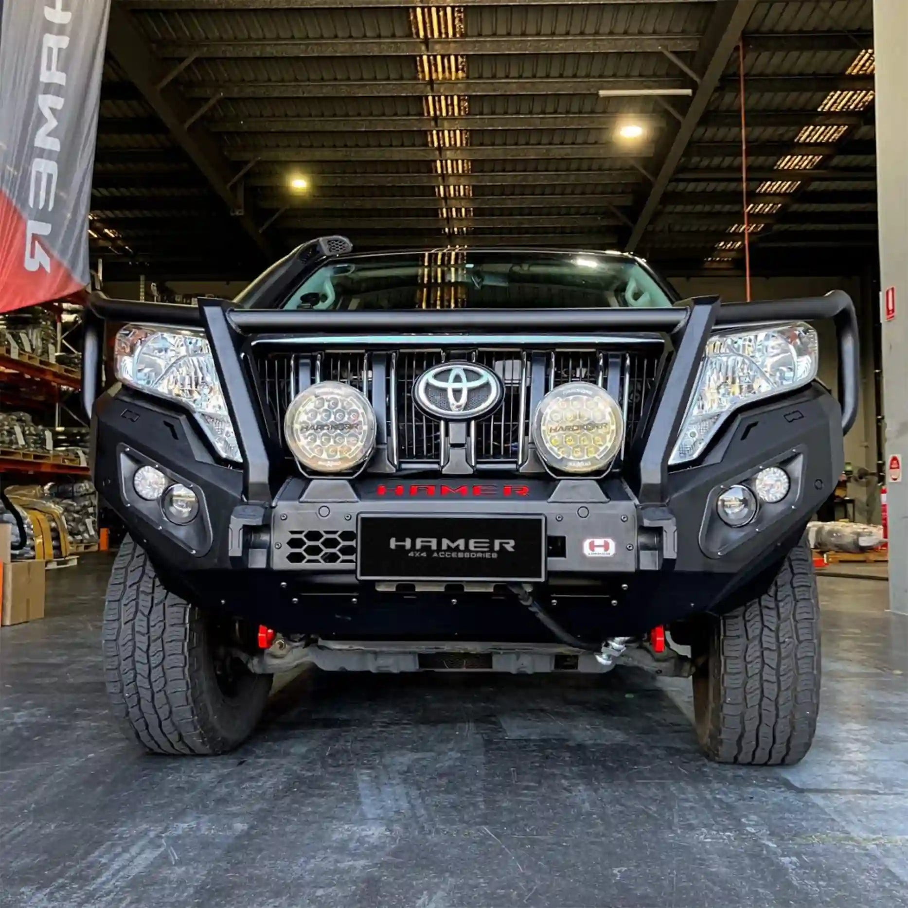 Angled display of Prado 150 (2013–2017) Hamer King Plus Bull Bar, designed for 4x4 off-road adventures with integrated LED lighting.