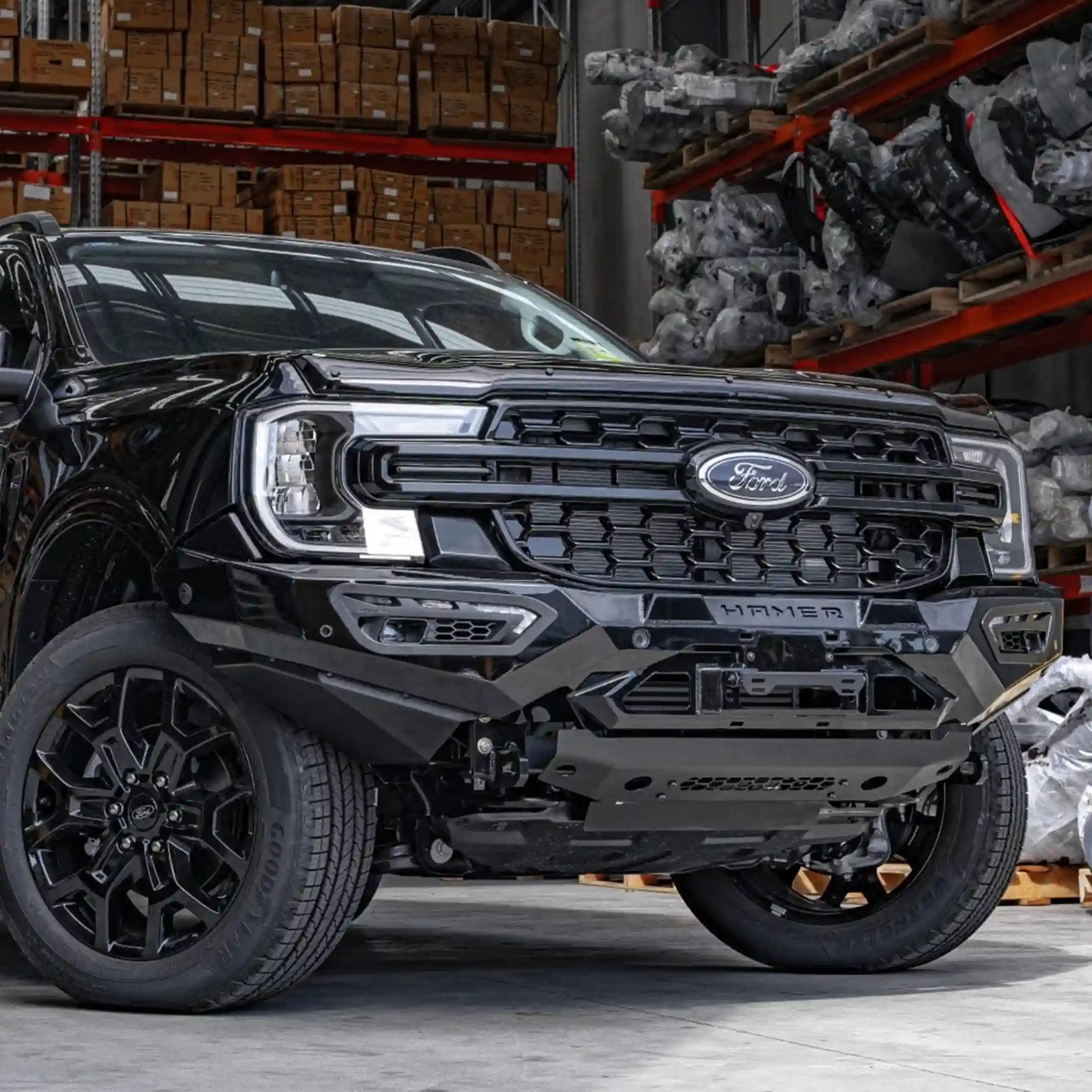 left angle view of ford everest 2022 fitted with atlas series bull bar in matte black powder coat highlighting sleek integration and winch compatibility elevated 4x4