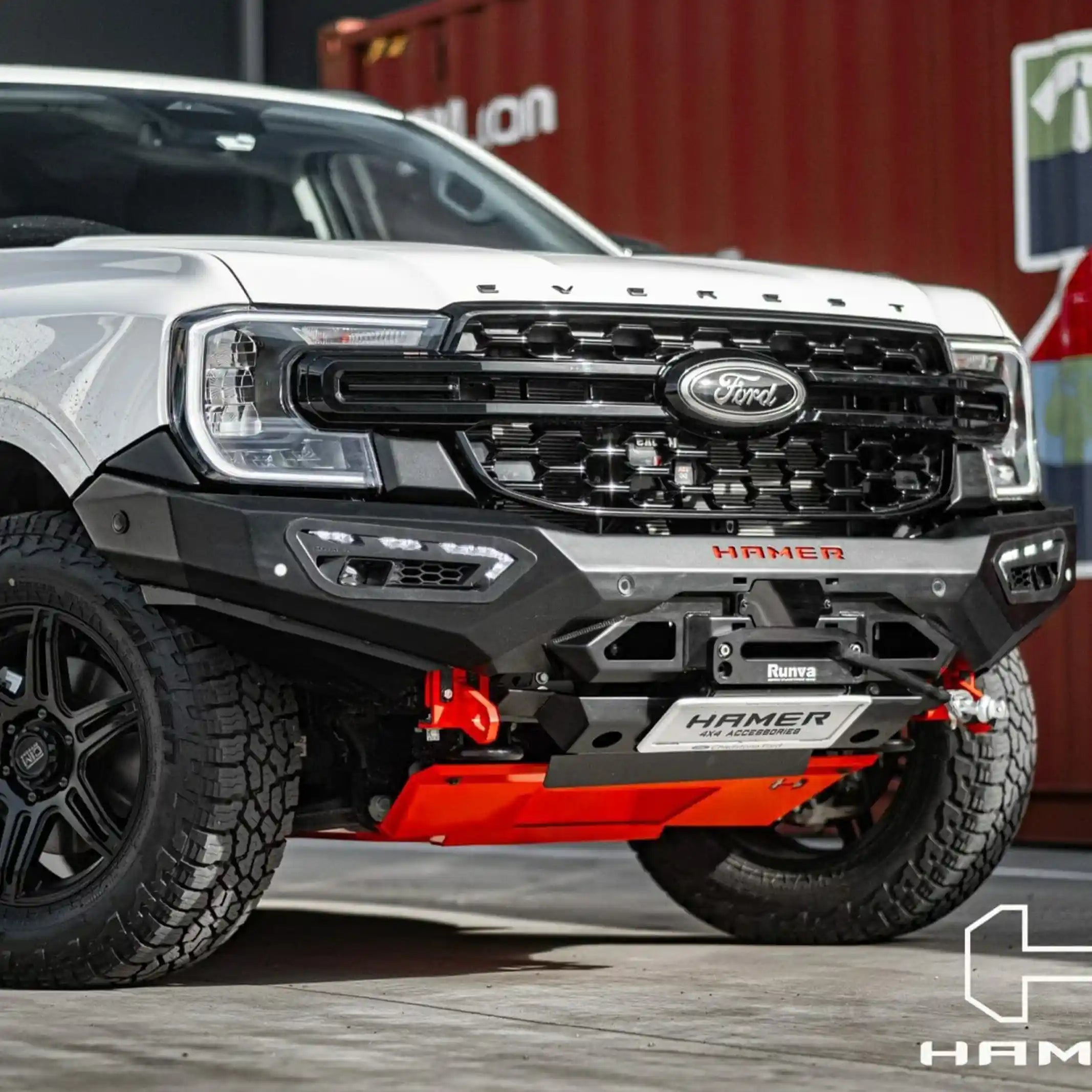 ford everest 2022 left side view with atlas series bull bar in white finish designed with recovery points and radar module compatibility elevated 4x4