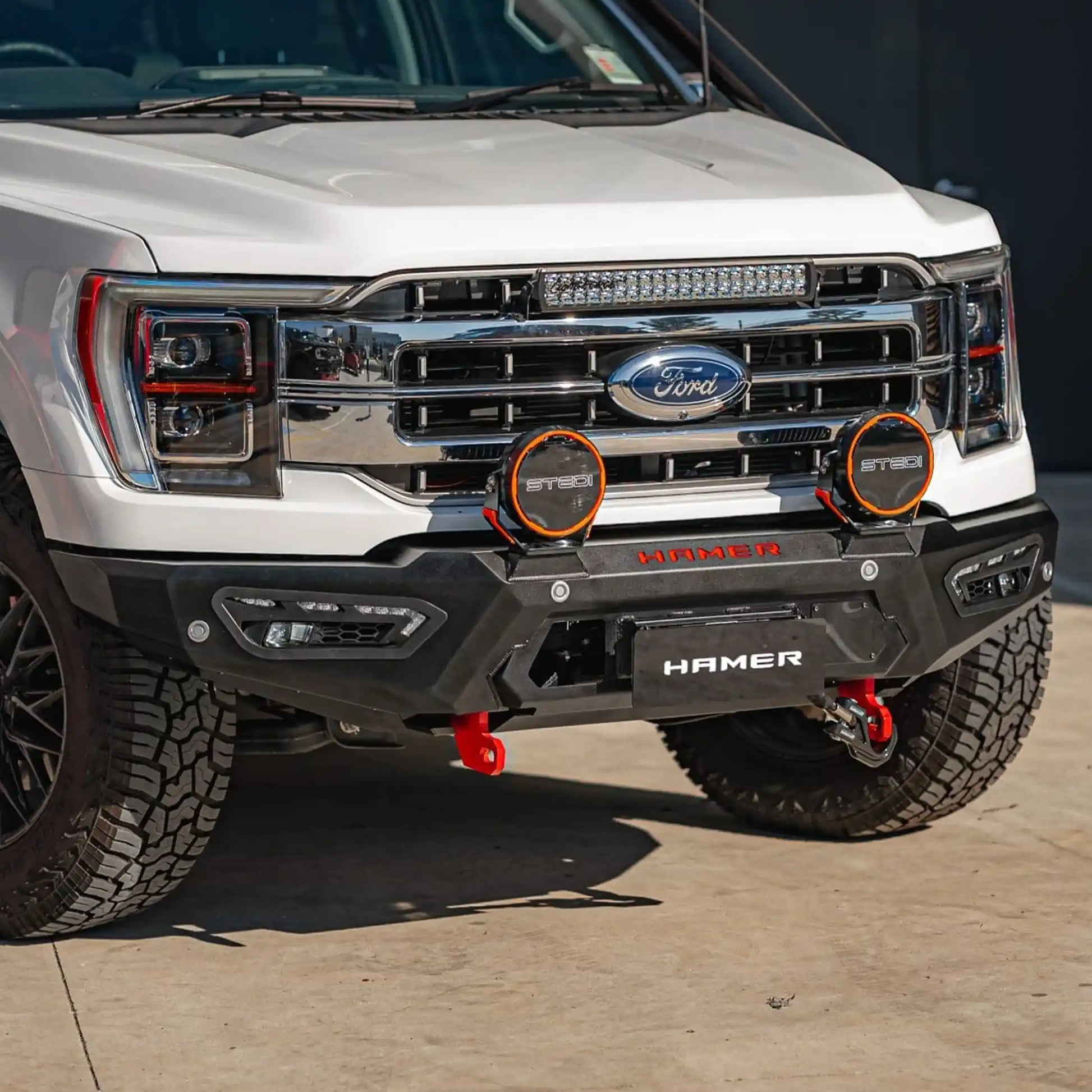 left side installed view of ford f150 with atlas series bull bar featuring radar compatibility recovery points and sleek steel bumper replacement elevated 4x4