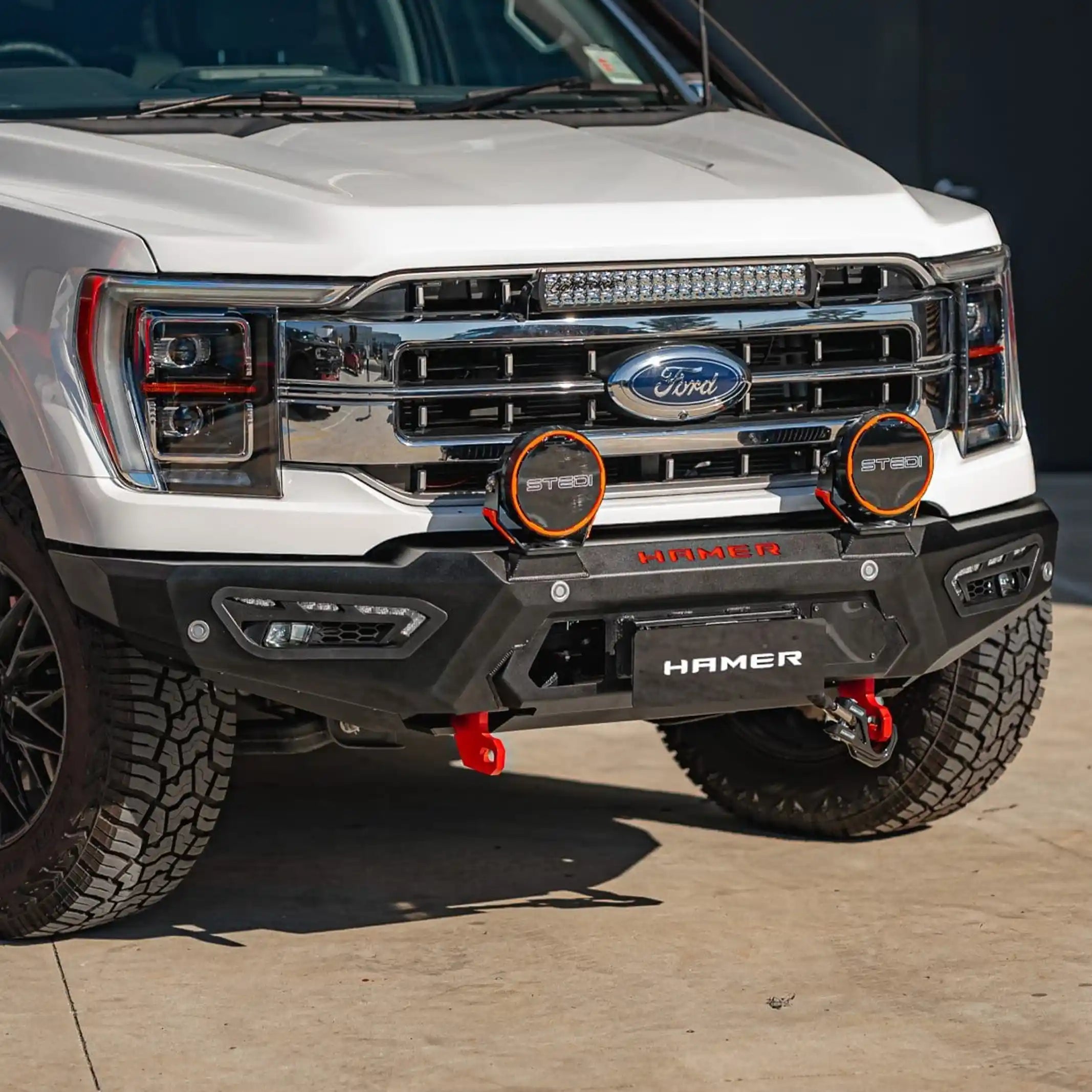 left side installed view of ford f150 with atlas series bull bar featuring radar compatibility recovery points and sleek steel bumper replacement elevated 4x4