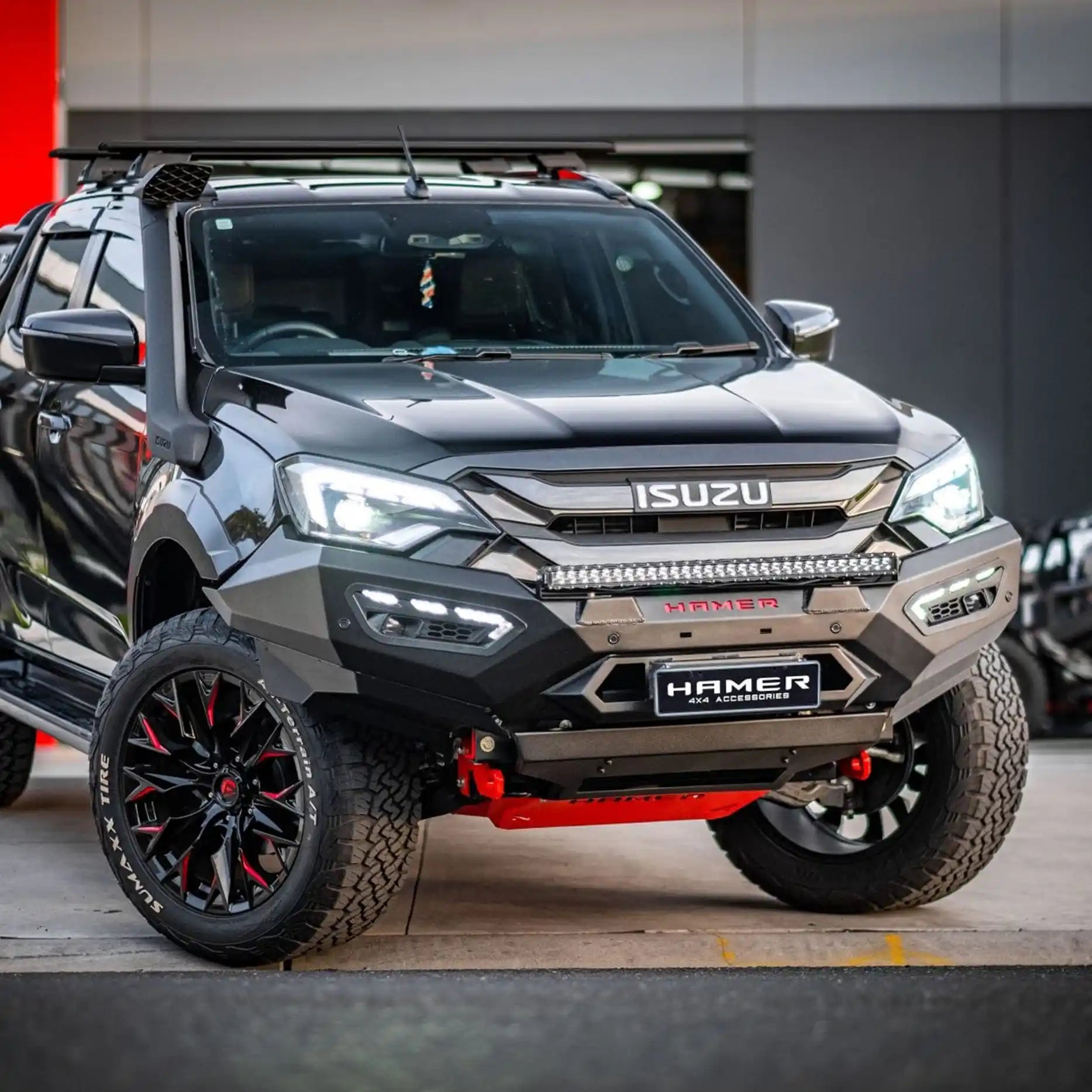 Left angle shot of 2024 Isuzu D-Max equipped with Atlas Series Bull Bar, showing sleek integration, compatibility with factory parking sensors and radar module, and rugged 3 mm steel construction.
