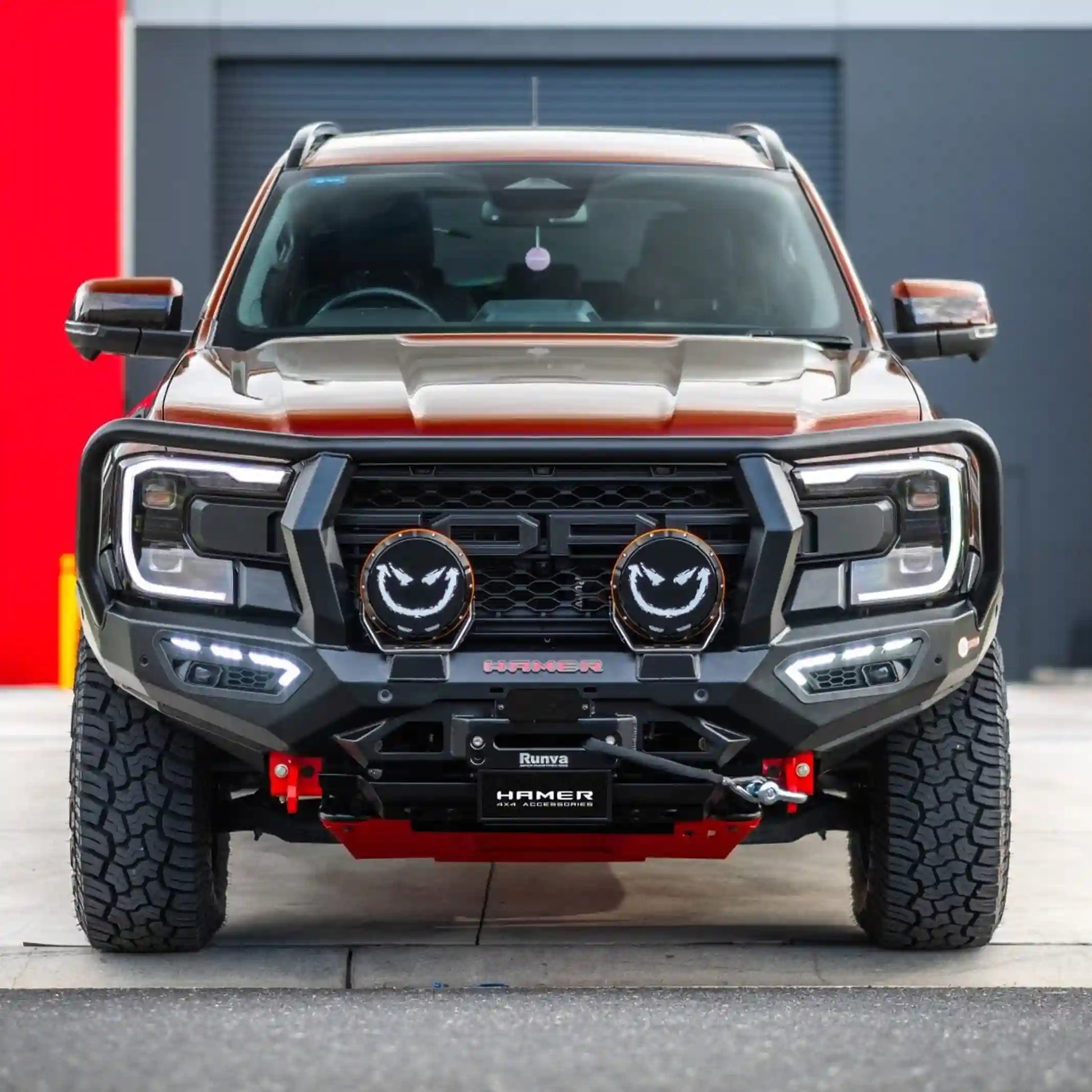 atlas series plus bull bar for ford everest 2022 red vehicle front view showing rugged bumper replacement adr approved design with fog lamps drls and recovery points elevated 4x4