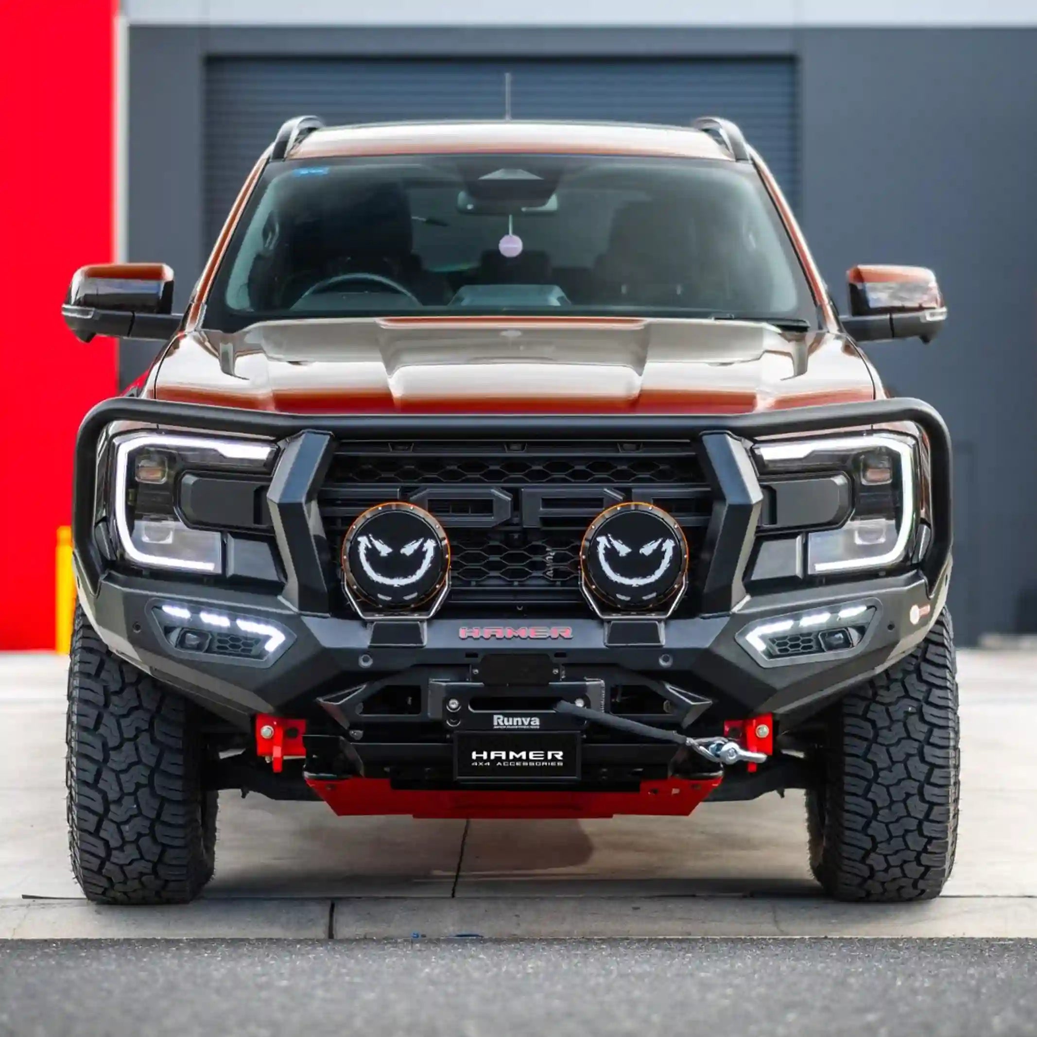 atlas series plus bull bar for ford everest 2022 red vehicle front view showing rugged bumper replacement adr approved design with fog lamps drls and recovery points elevated 4x4