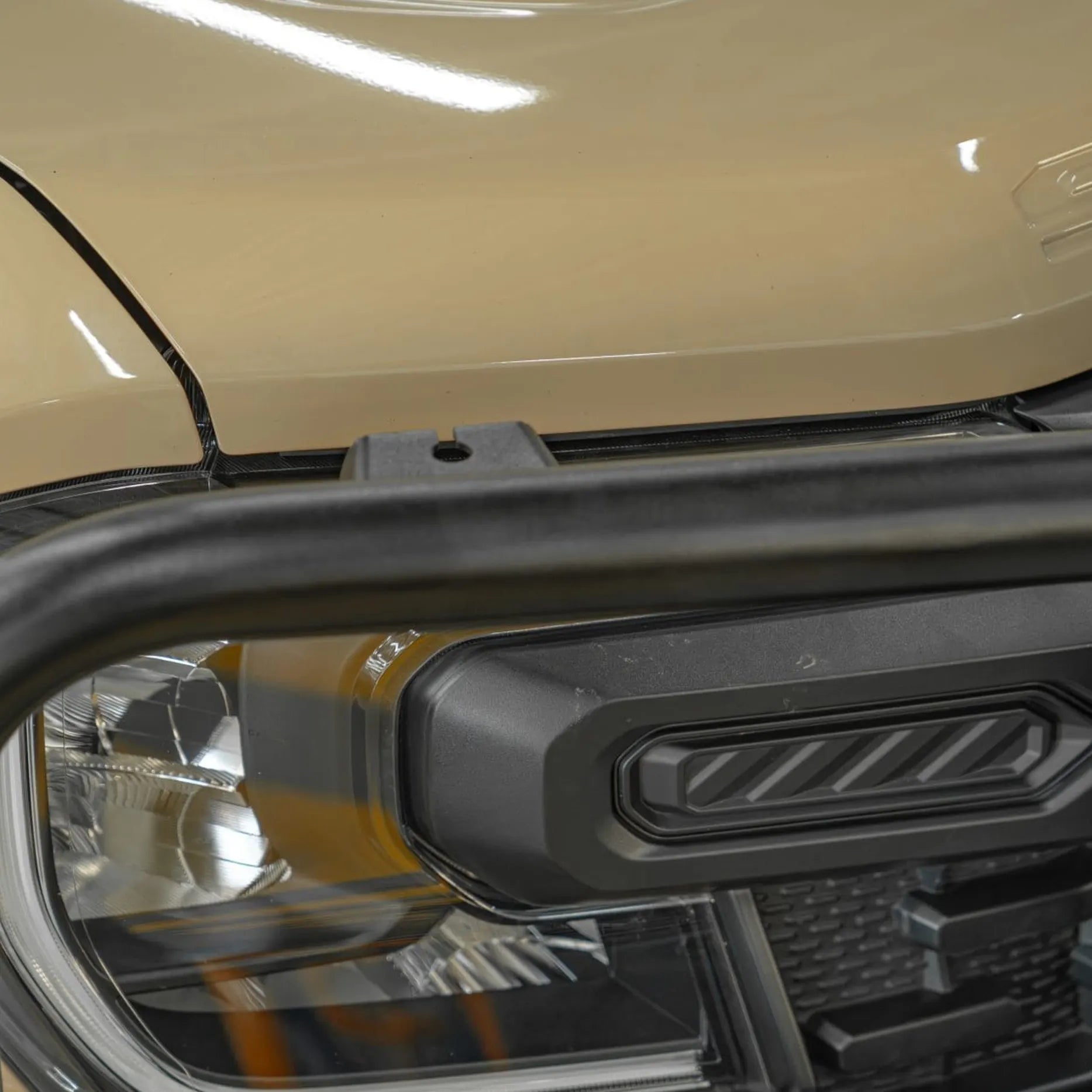 Close-up right detail of the Atlas Series Plus Bull Bar on a Ford Ranger Super Duty, featuring high-grade steel construction, precision welds, and integrated lighting elements. Finished in matte black and supplied by Elevated 4x4, it delivers premium durability and refined styling for modern off-road builds in Nelson Bay and surrounding regions.