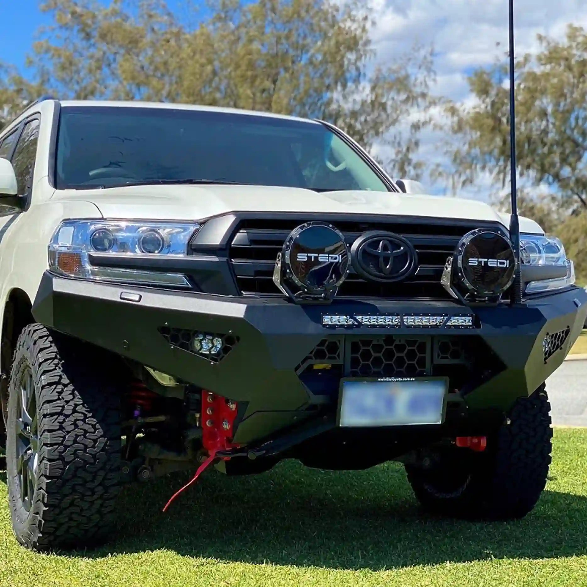 Matte black powder-coated Offroad Animal Predator Bull Bar fitted to a Toyota Land Cruiser 200 Series, highlighting its zinc-plated durability and factory-style integration. Professionally finished by Elevated 4x4, it delivers a bold, protective front-end upgrade ideal for Newcastle and Maitland adventurers.
