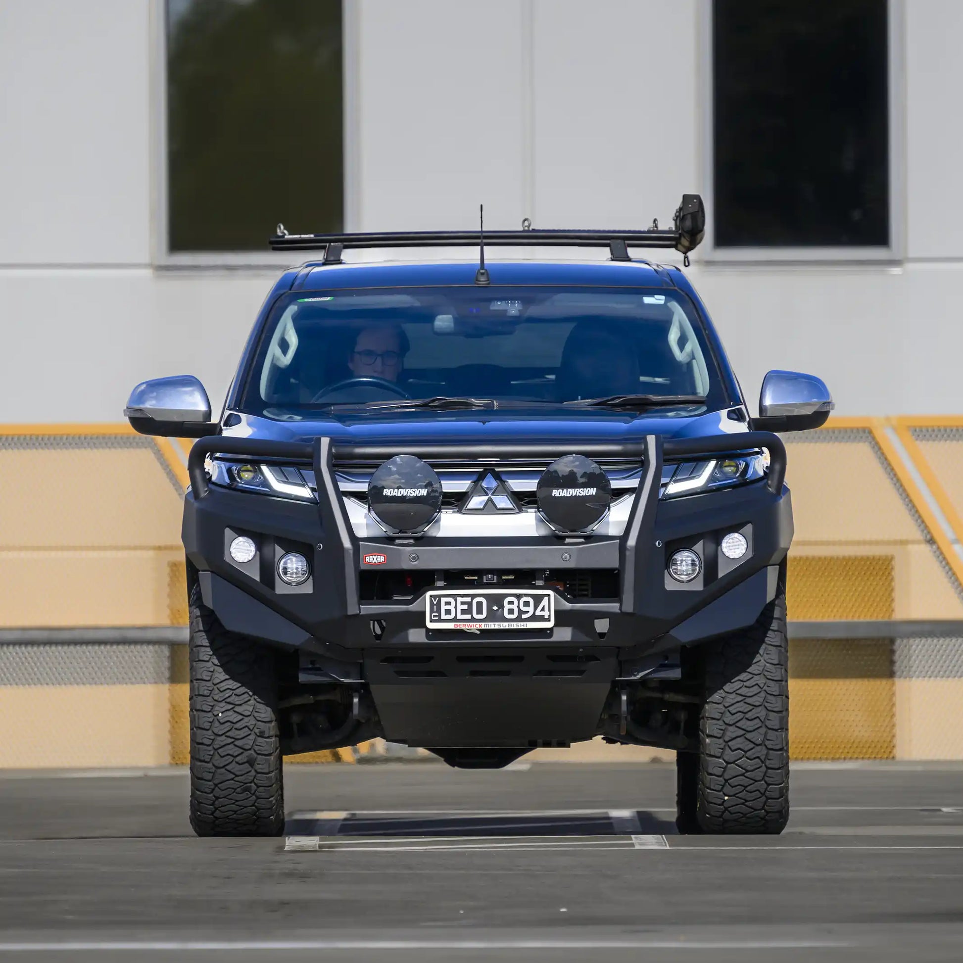 Front installed view of the RAXAR looped bull bar on Mitsubishi Triton MR, showcasing its strong bumper replacement design, durable matte black finish, and winch compatibility. A premium 4WD upgrade available Australia-wide at Elevated 4x4.