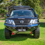 Front view of the Offroad Animal Cobra Bull Bar installed on a Nissan Patrol Y62 Series 5, showing its full-width steel construction and aggressive design. Engineered by Elevated 4x4, this bar enhances protection, airflow, and winch mounting capability for superior off-road strength and on-road style.