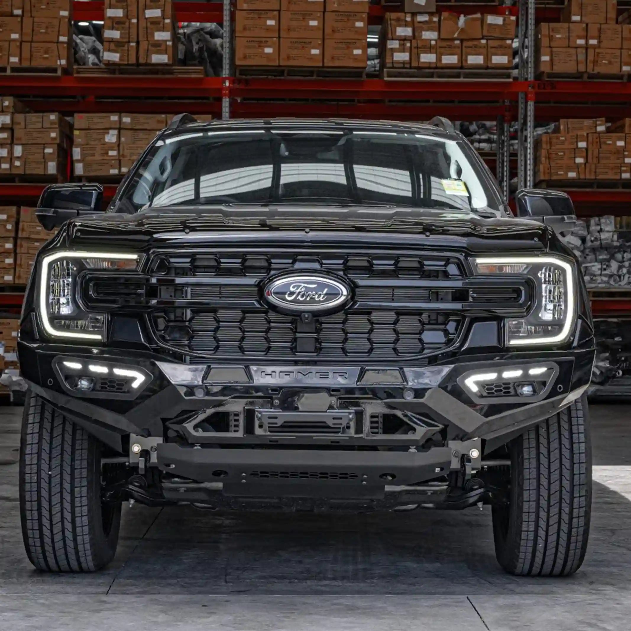 ford everest 2022 with atlas series bull bar black finish front view showing adr compliant rugged design and sequential led lights elevated 4x4