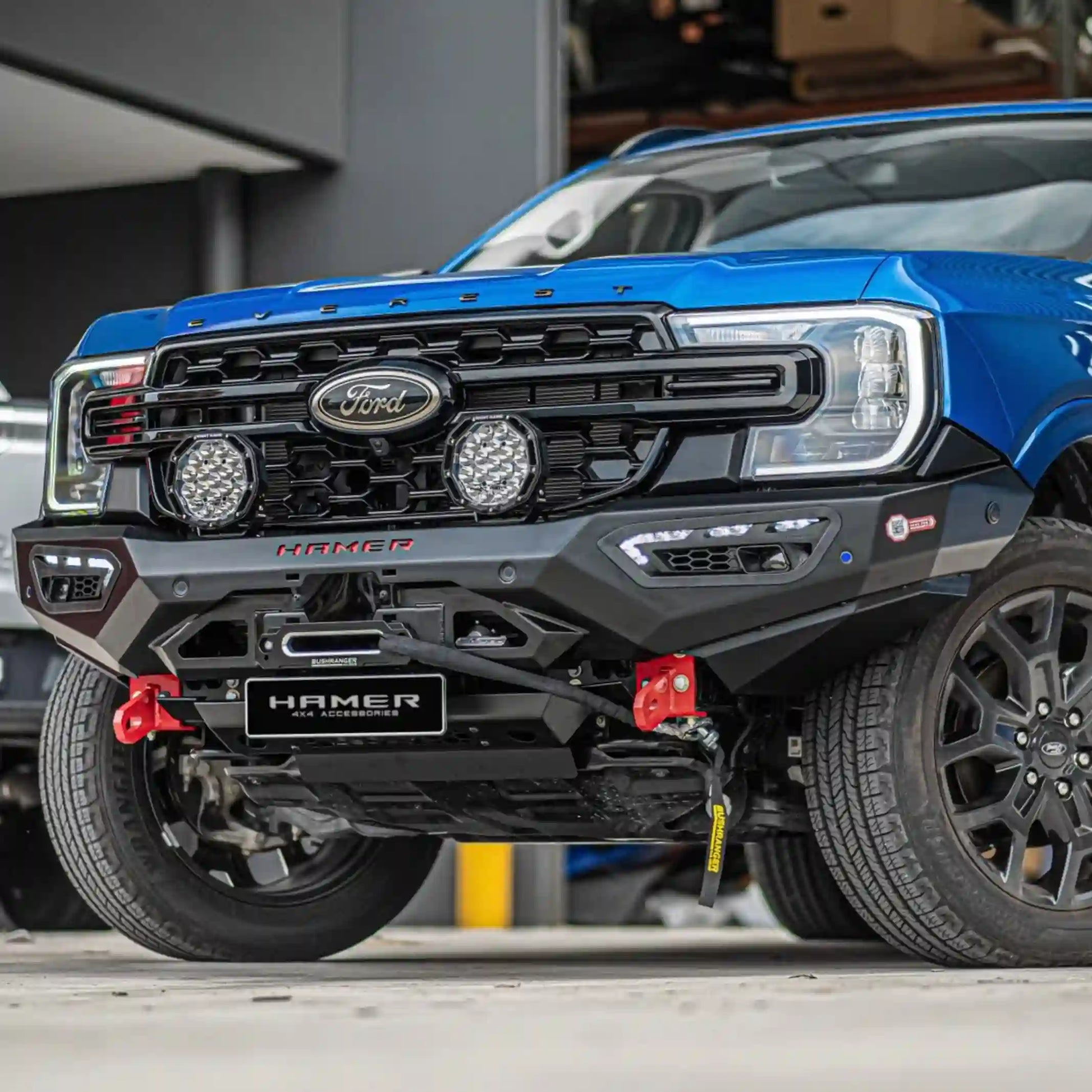 ford everest 2022 blue atlas series bull bar right side installation highlighting rugged build sequential lighting and factory sensor compatibility elevated 4x4