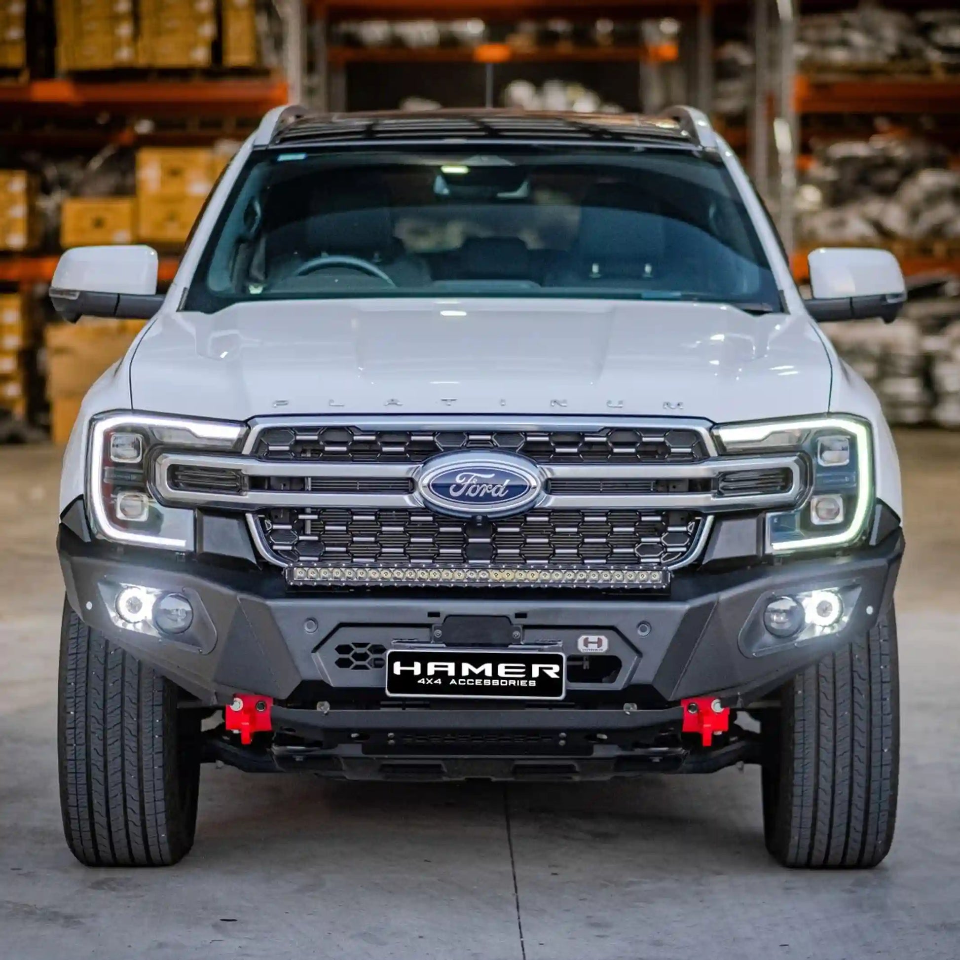 straight front installed view of ford everest 2022 fitted with hamer king series bull bar showcasing adr compliance matte black finish and integrated led lights elevated 4x4