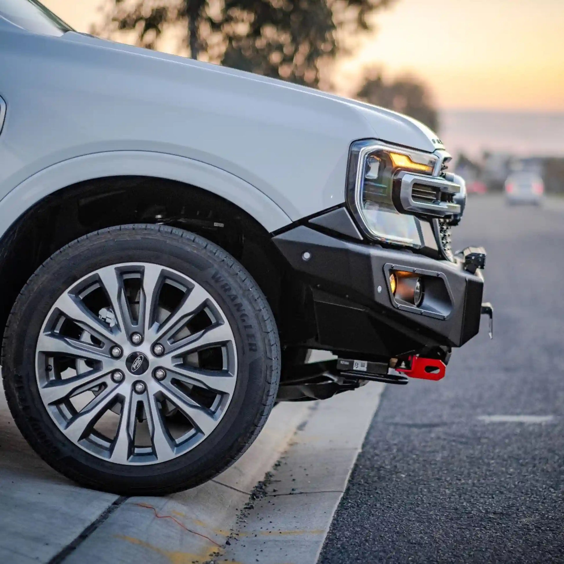 left side installed close-up of ford everest 2022 highlighting hamer king series bull bar sleek fitment and led lighting system elevated 4x4