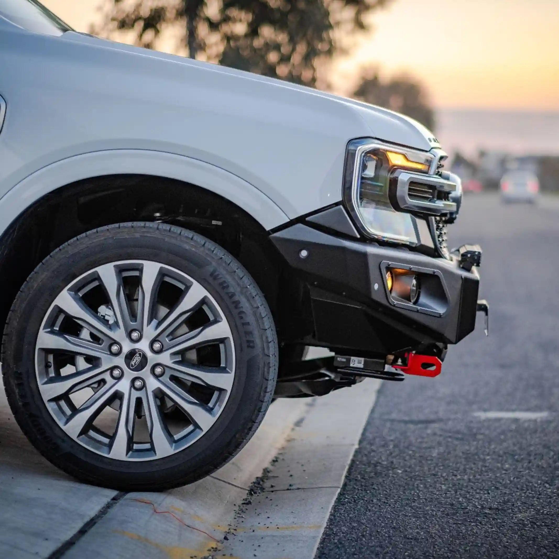 left side installed close-up of ford everest 2022 highlighting hamer king series bull bar sleek fitment and led lighting system elevated 4x4