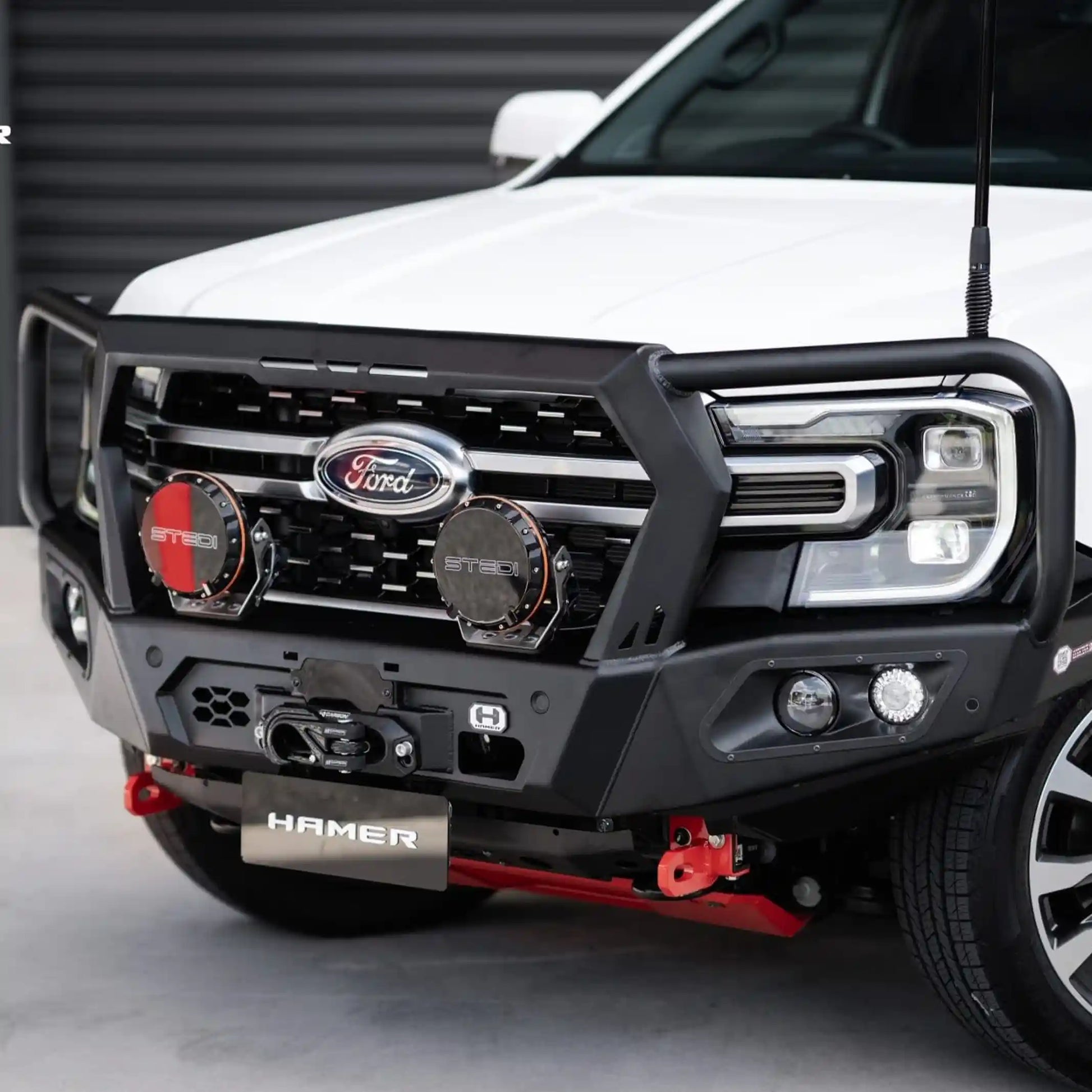 right side angle of ford everest 2022 equipped with hamer king series plus bull bar featuring recovery points and winch-ready design elevated 4x4