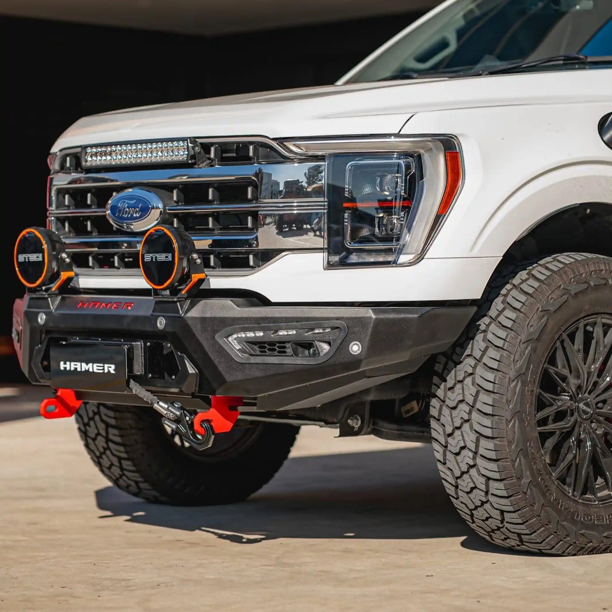 right installed view of ford f150 2021 showcasing atlas series bull bar design with winch compatibility fog lights and durable 3mm steel build elevated 4x4
