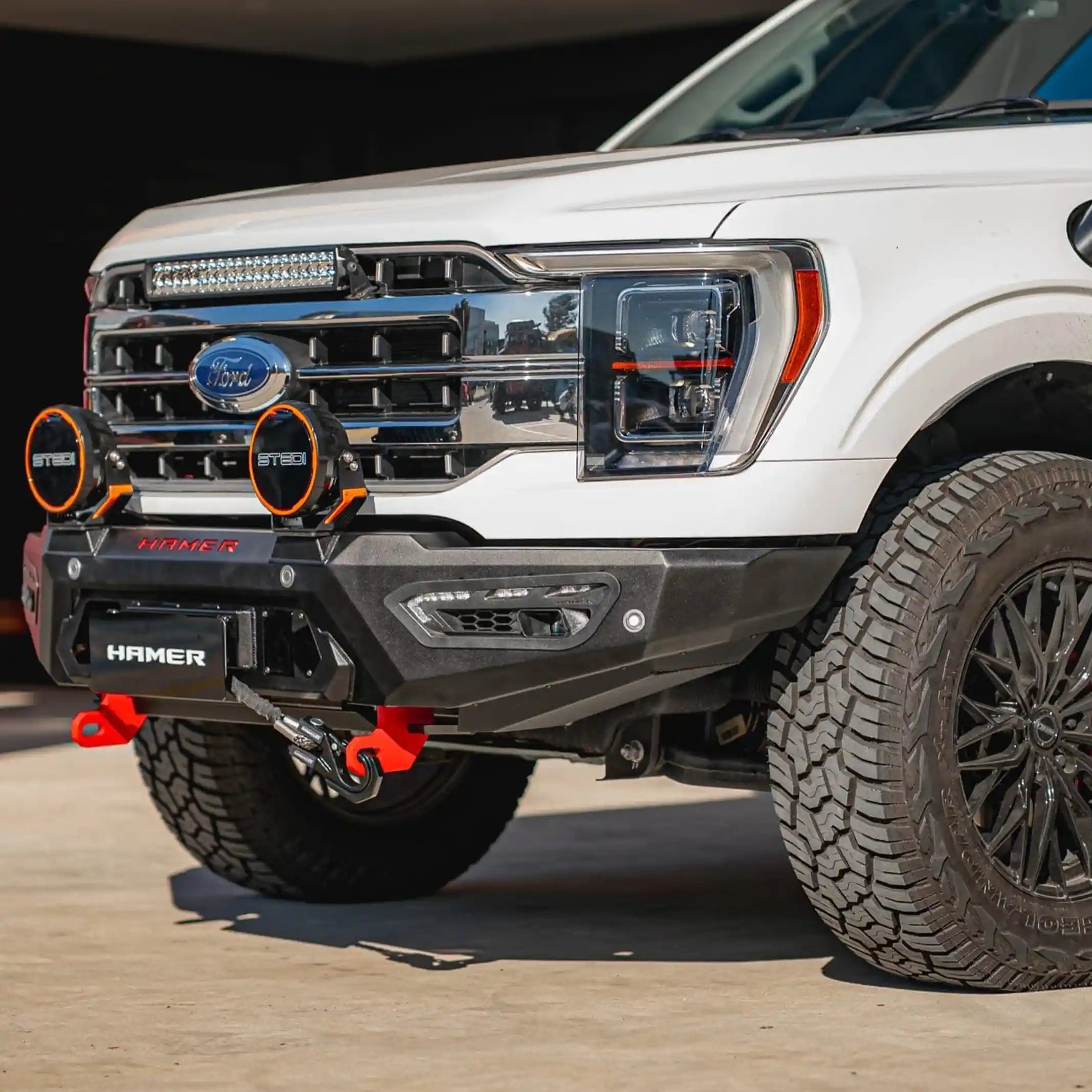 right installed view of ford f150 2021 showcasing atlas series bull bar design with winch compatibility fog lights and durable 3mm steel build elevated 4x4