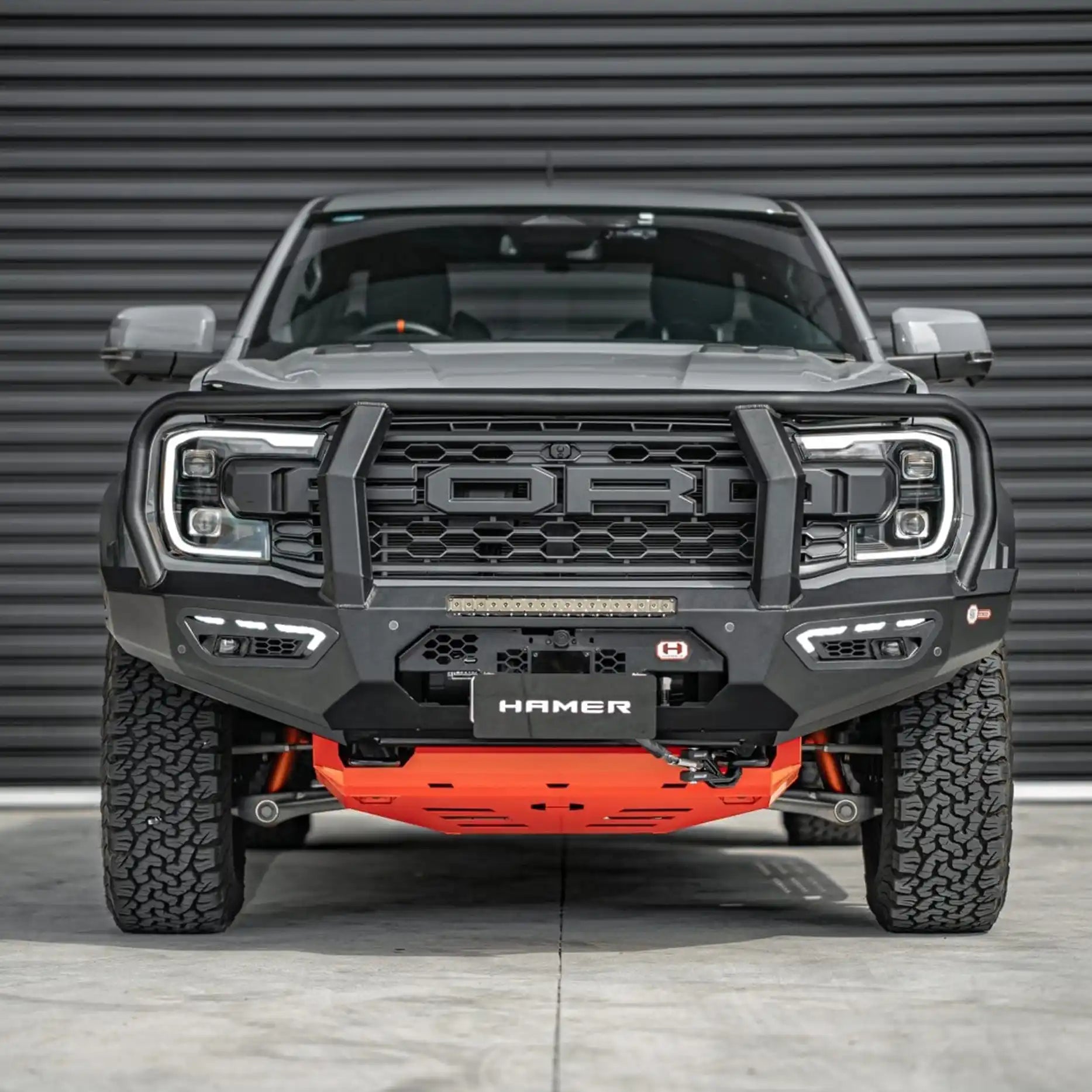 Front view of the Ford Ranger Raptor (2022 – Present) fitted with the Hamer Atlas Series Plus Bull Bar, showcasing its sleek matte black powder-coated finish, full bumper replacement design, and ADR compliance.