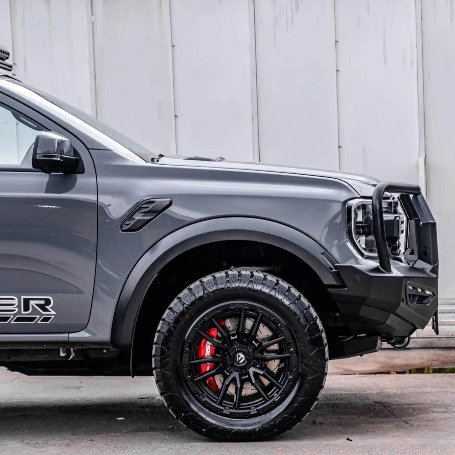 Left side profile of the Ford Ranger Raptor with the Hamer Atlas Series Plus Bull Bar, constructed from 3 mm high-grade steel with mounting points for off-road accessories.