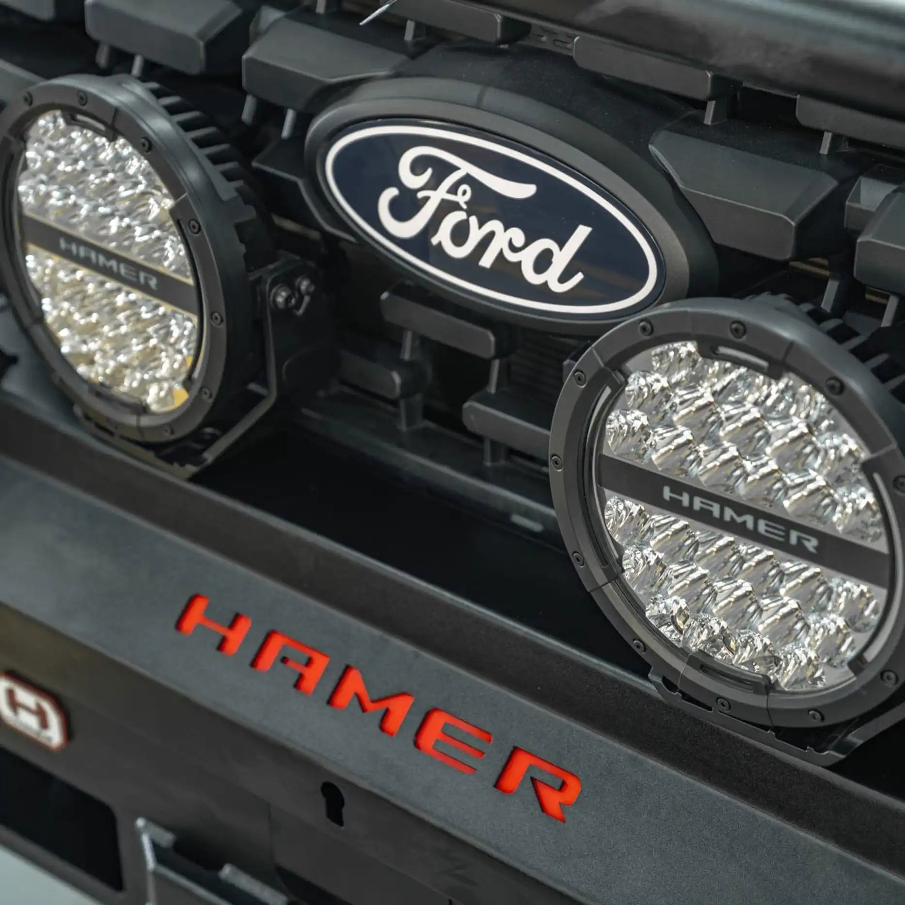 Front close-up of the Atlas Series Plus Bull Bar on the Ford Ranger Super Duty 2025+, highlighting the European E-Mark certified LED lighting, number plate flip, and winch-ready design. Developed for performance and compliance, this bull bar is a standout upgrade offered by Elevated 4x4 for serious touring vehicles throughout the Hunter region.