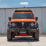 Front view of the GWM Tank 300 (2023 – Present) fitted with the Hamer King Series Plus Bull Bar, showcasing its bold triple-loop design, ADR compliance, and integrated LED lighting system in a matte black powder-coated finish.