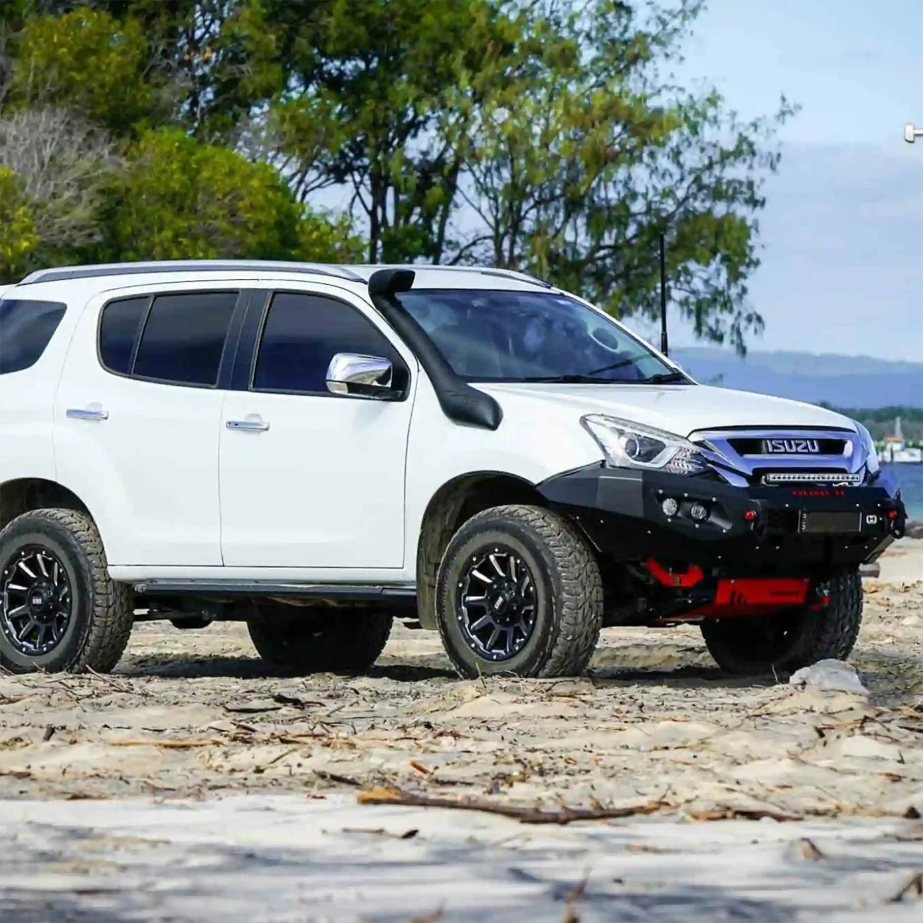 Left side view of Isuzu MU-X 2016–2020 equipped with Hamer King Series Bull Bar, featuring winch compatibility, parking sensor integration, and off-road-ready durability.