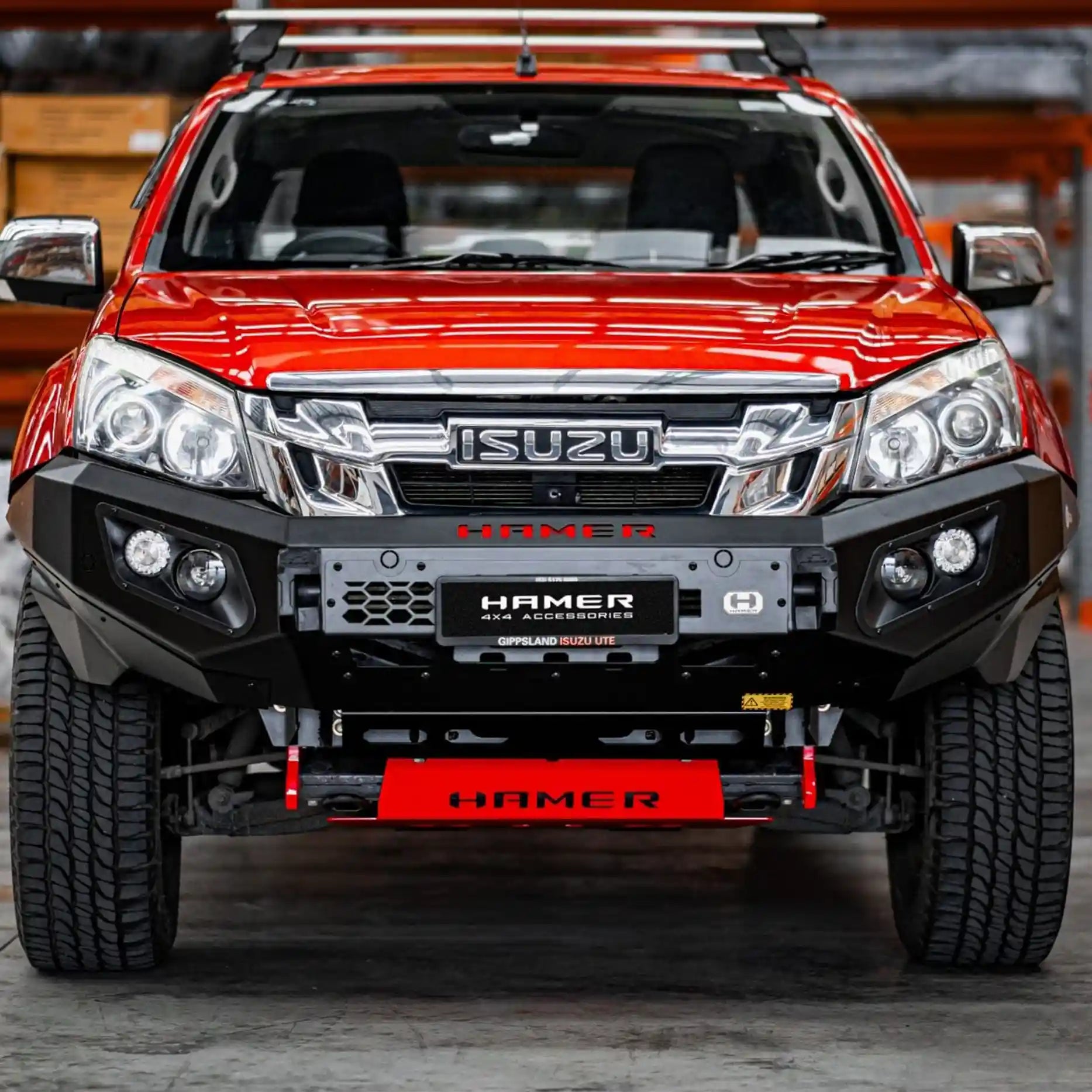 Angled front view of Hamer King Series Bull Bar on Isuzu D-Max 2012–2016, showcasing rugged steel construction, recovery points, and integrated sensors.