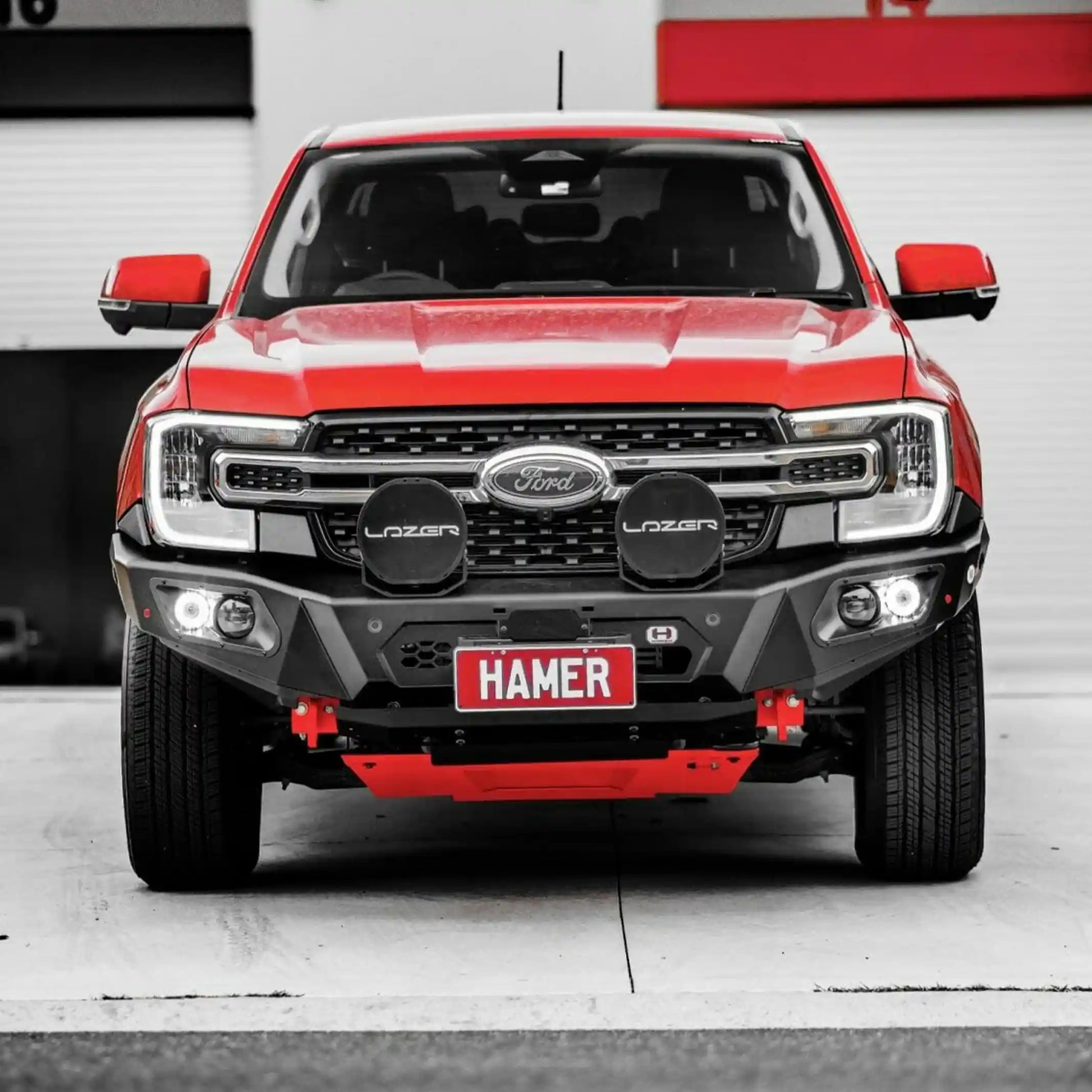 Front installed view of Hamer 4x4 King Series Bull Bar on Ford Ranger (2022–Present), showing matte black finish, ADR compliance, and LED lighting.