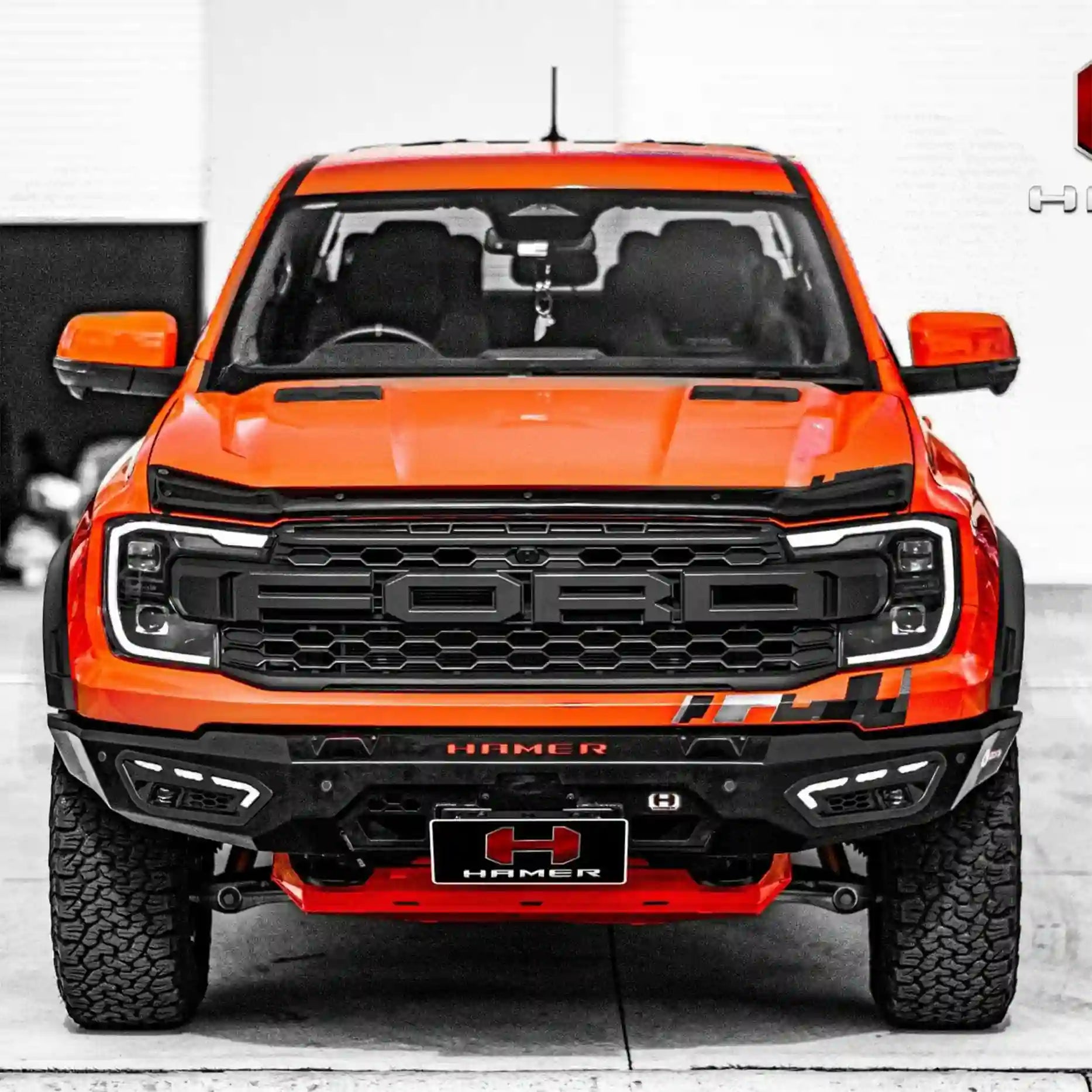 Close-up front shot of the Hamer Atlas Series Bull Bar on the Ford Ranger Raptor 2022+, showing E-Mark certified fog lights, DRLs, and winch lever access.