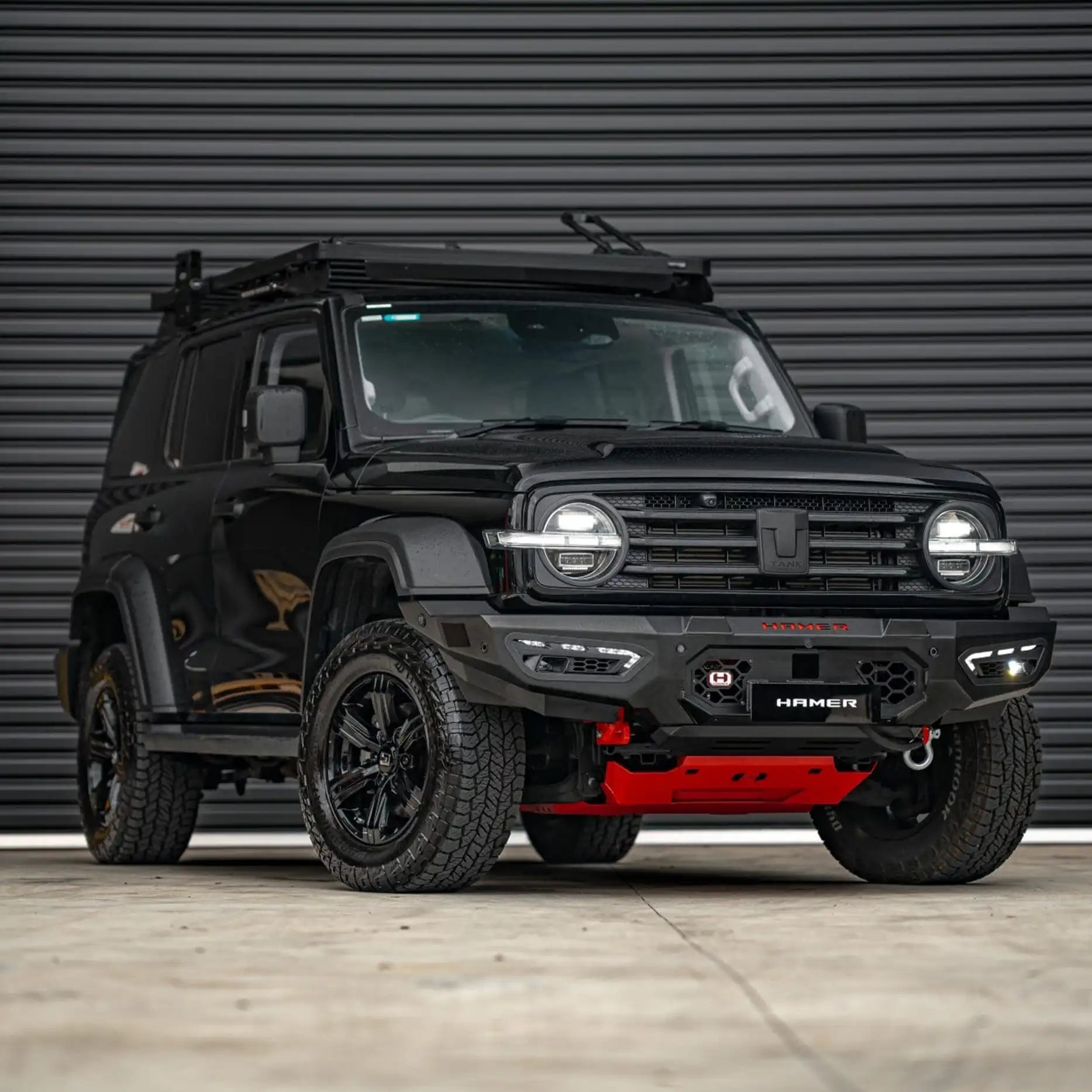 Profile shot of GWM Tank 300 with Hamer Atlas Bull Bar, designed with number plate flip, aerial mounts, and splash guard protection.