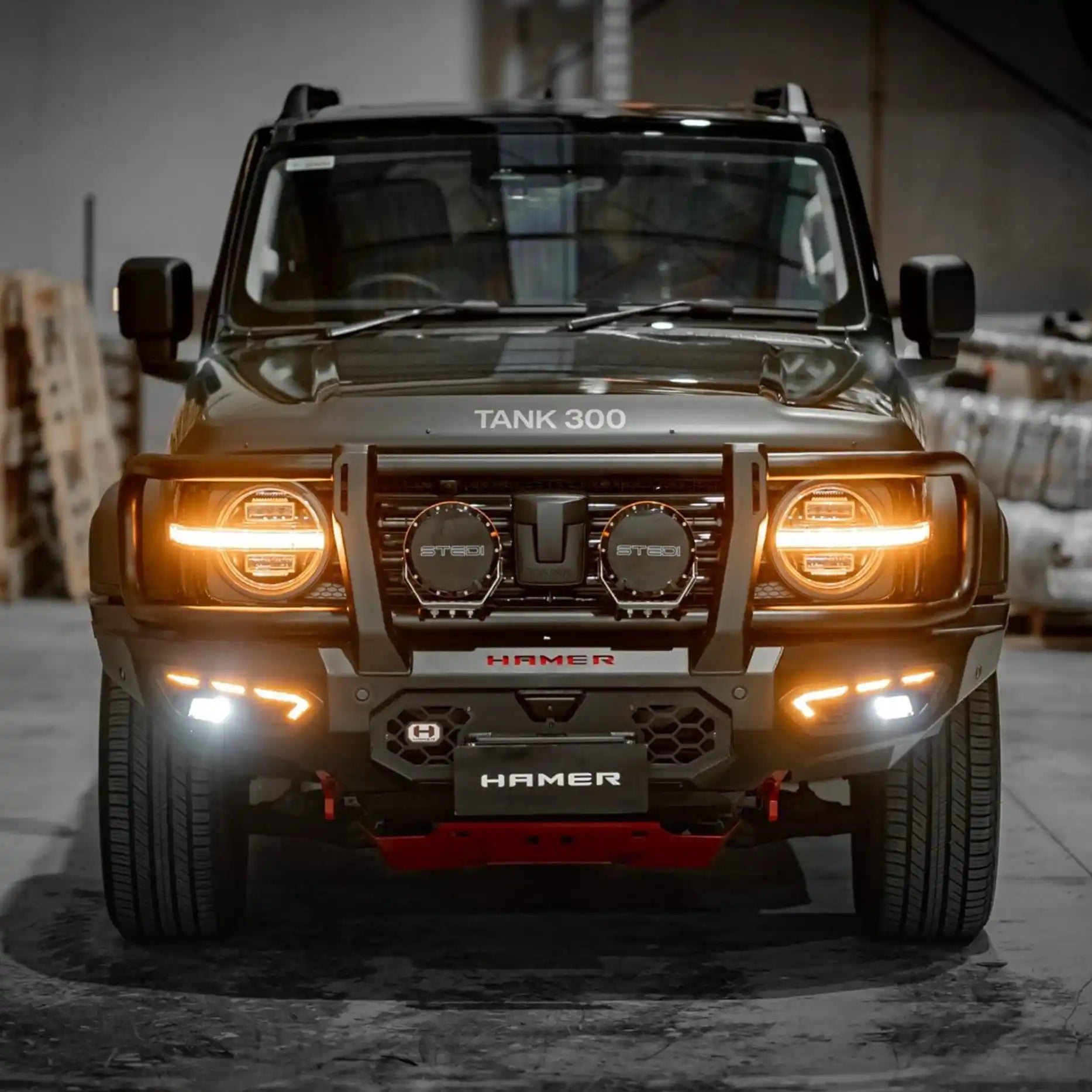Angled front perspective of the GWM Tank 300 with the Hamer Atlas Plus Bull Bar, highlighting integrated LED lights, winch compatibility, and radar module support. Ideal for Maitland and Central Coast adventures.