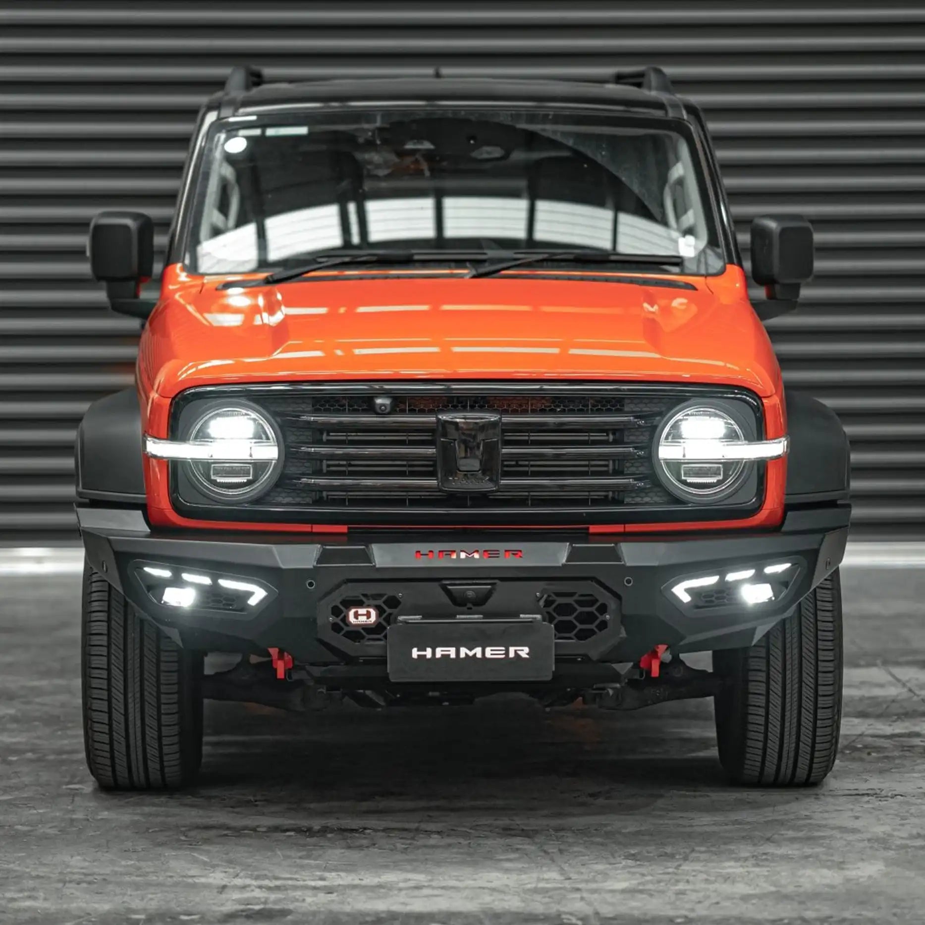 Angled front perspective of GWM Tank 300 with Hamer Atlas Bull Bar, showcasing integrated LED lighting, winch compatibility, and radar module support.