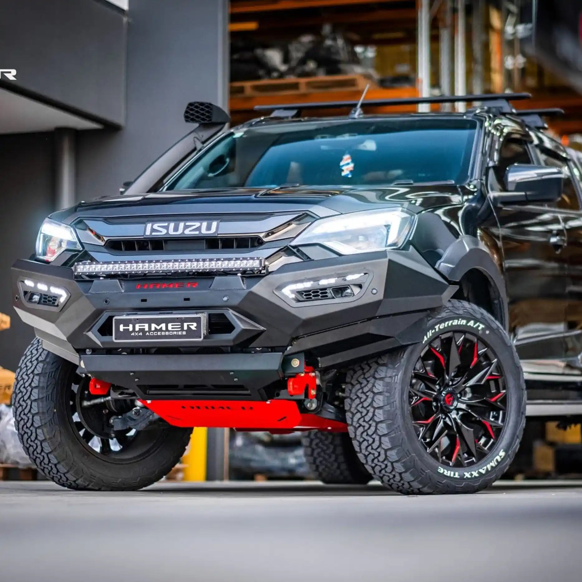 Right side view of Isuzu D-Max 2024 fitted with Hamer Atlas Series Bull Bar, highlighting winch compatibility up to 12,000 lb, aerial mounting points, and durable matte black powder-coated finish.