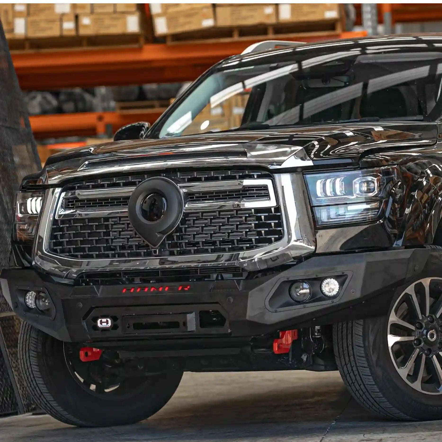 Right perspective of GWM Cannon Alpha Hamer King Series Bull Bar, designed with mounting points for extra lights, number plate flip, and winch lever access.