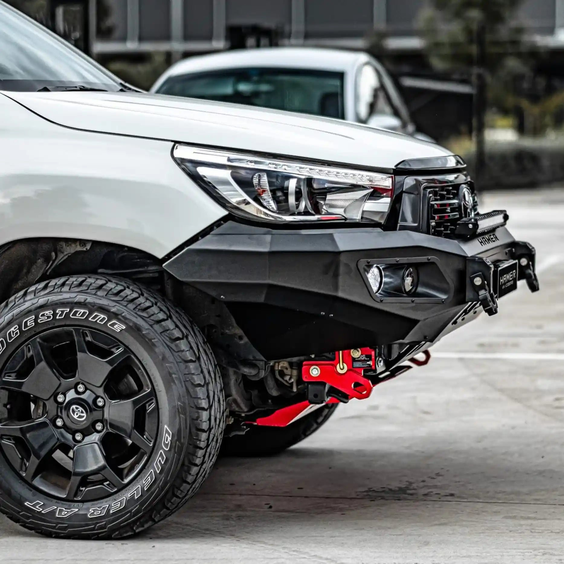 Left angle of Toyota Hilux (2018–2020) showing Hamer King Bull Bar, stylish matte black finish, aerial and light mounts included.