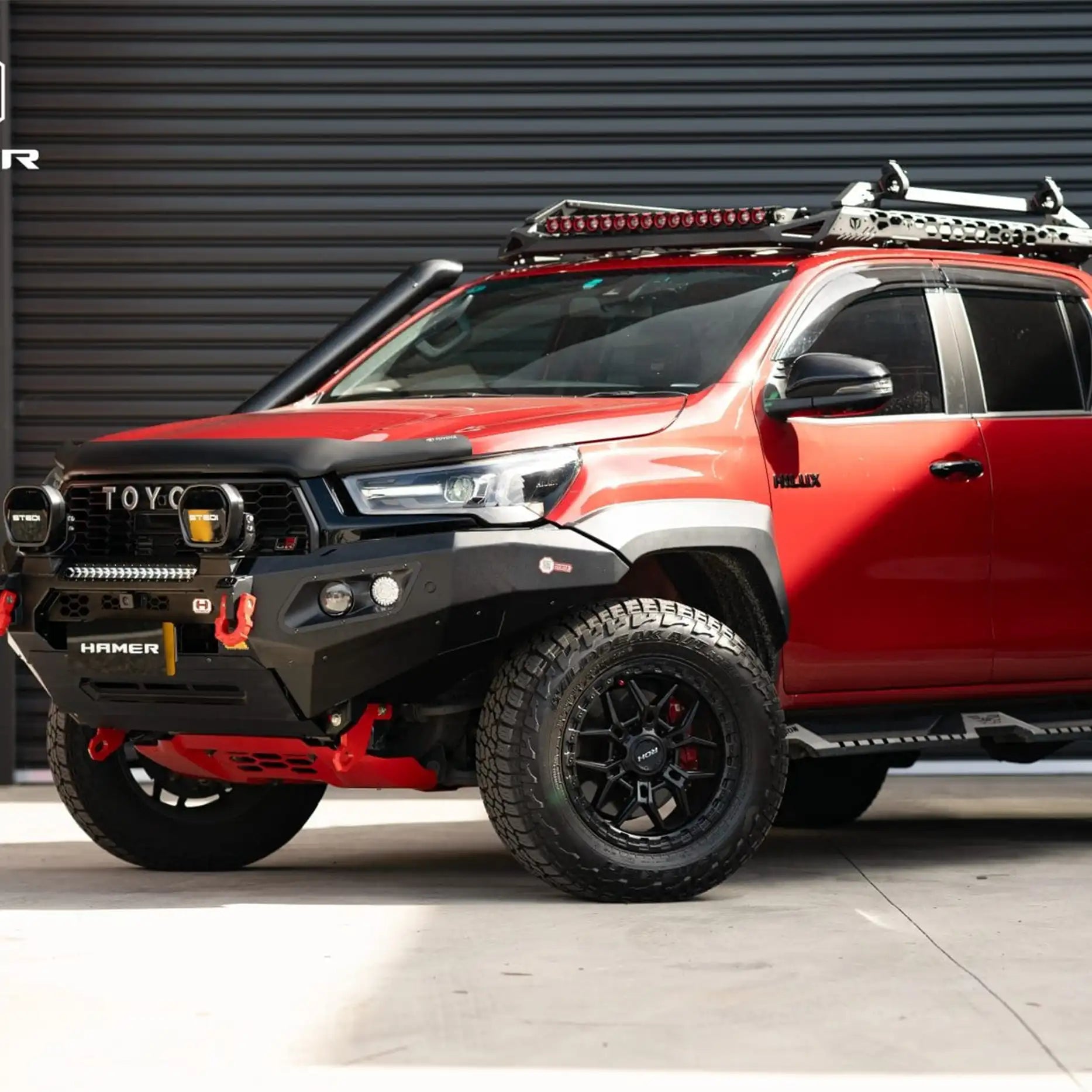 Right side of Toyota Hilux GR (2023–Present) equipped with Hamer King Bull Bar, strong off-road protection and LED indicators.