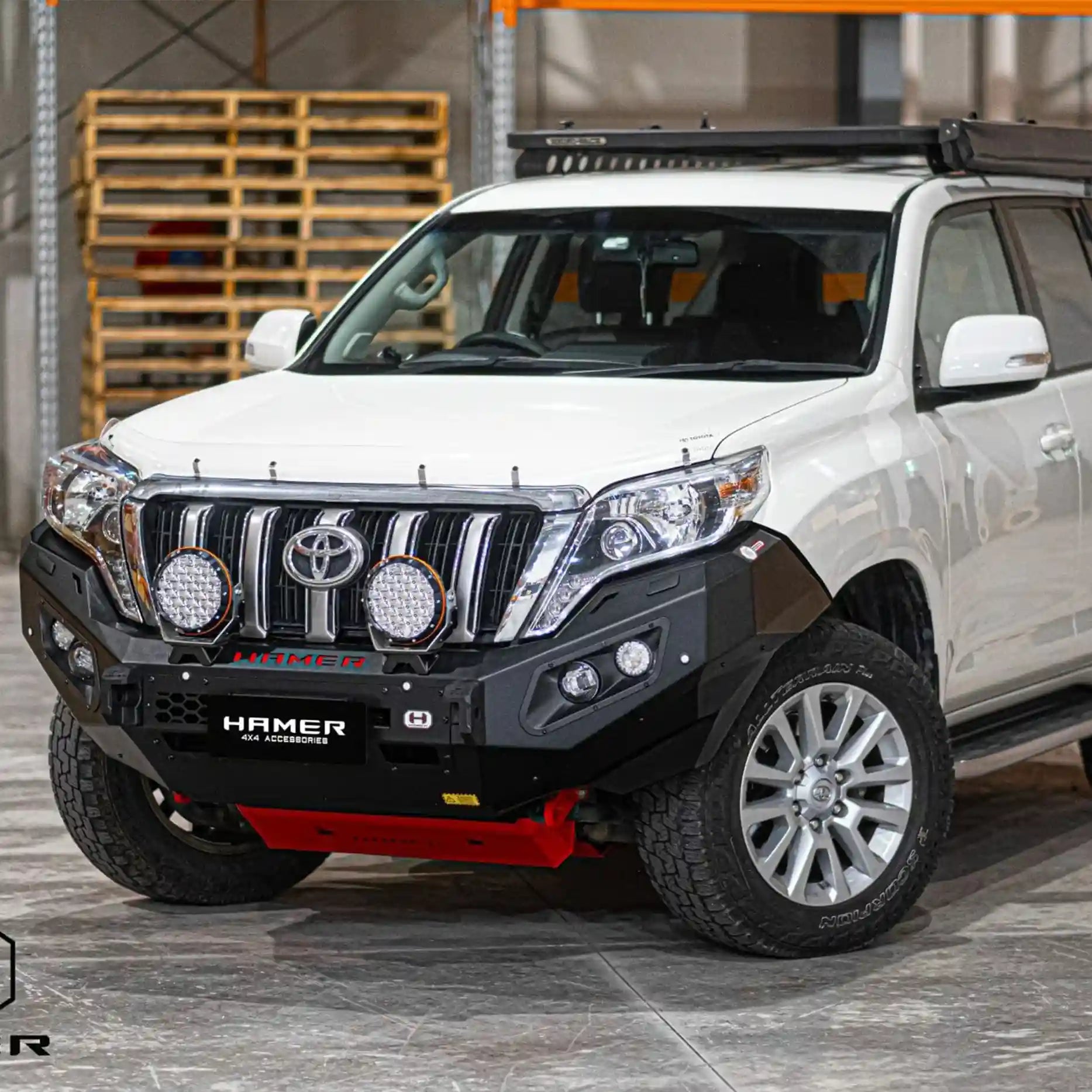 Right angle of Toyota Prado 150 (2013–2017) showing Hamer King Bull Bar, sleek bumper replacement with LED lighting.