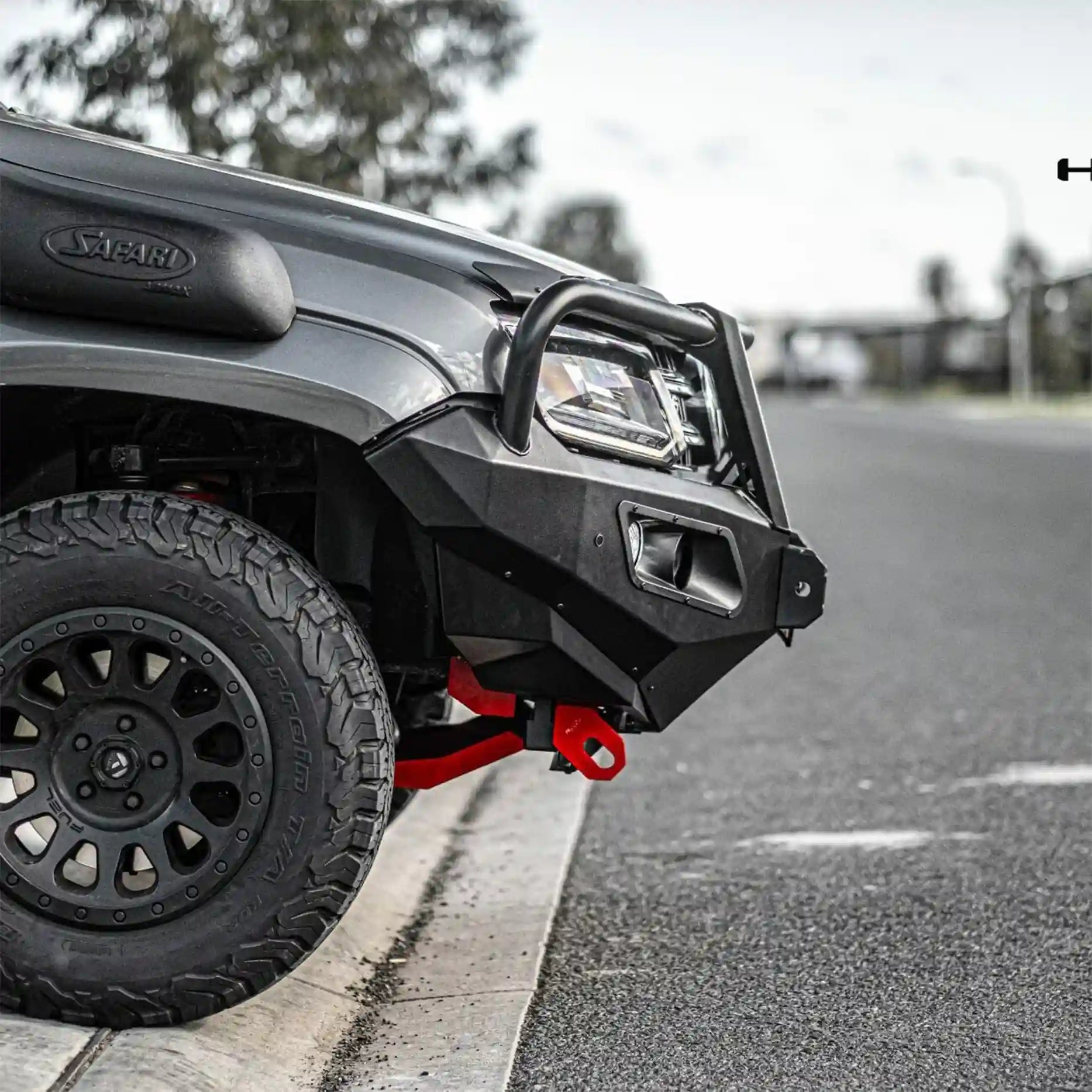 Close-up of left section on Volkswagen Amarok Hamer King Series Plus Bull Bar, highlighting recovery points, matte black coating, and light bar slot integration.