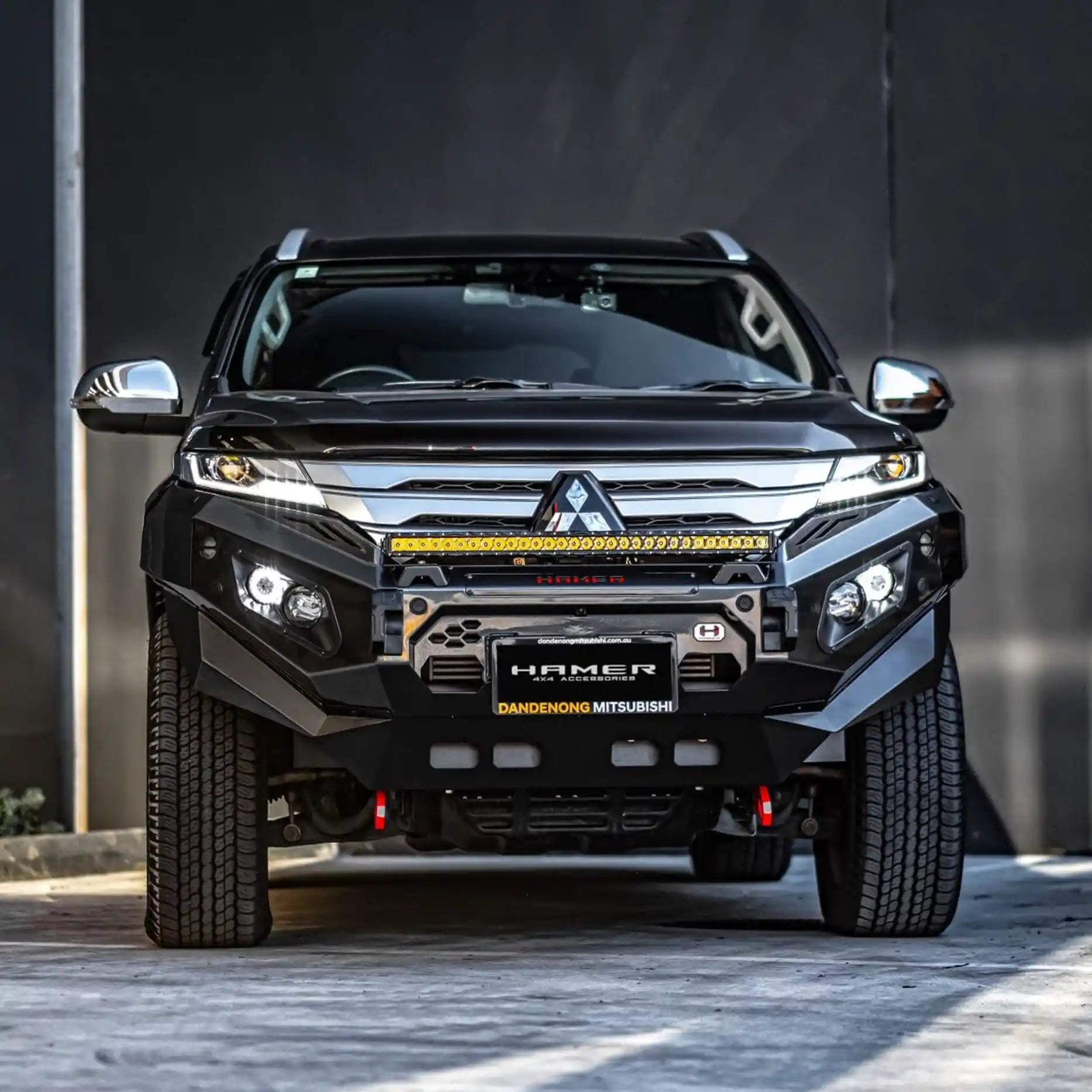 Direct front view of Mitsubishi Pajero Sport QG (2024–Present) featuring Hamer King Series Bull Bar in matte black, winch ready with recovery points.