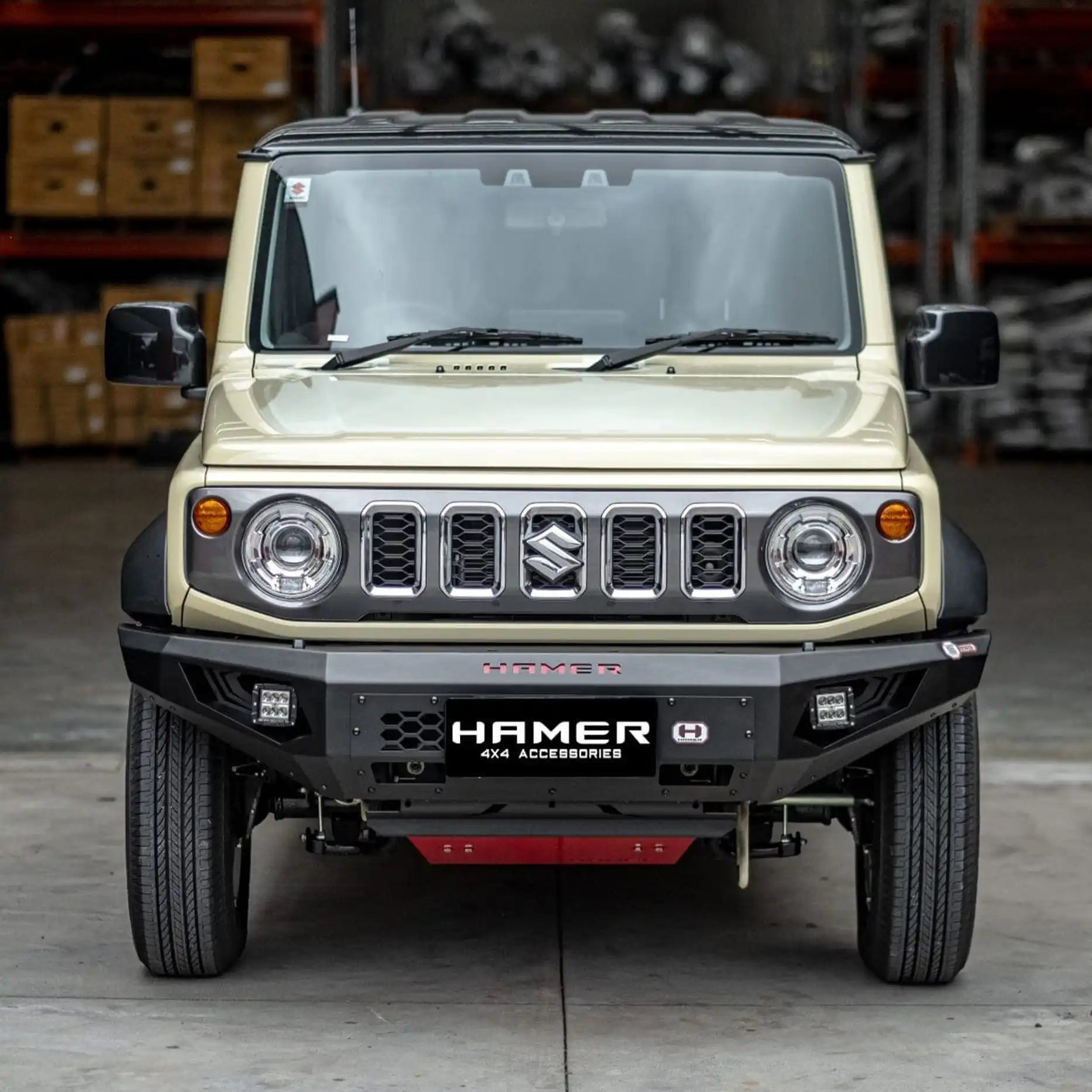 Front angle of Jimny XL 2023 fitted with Hamer King Bull Bar, rugged design with recovery points and integrated LED lights.