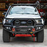 Front installed view of the Hamer King Series Plus Bull Bar on a Ford Everest (2015–2022) by Elevated 4x4 in Australia. This premium off-road accessory features ADR-compliant 3 mm high-grade steel, European-certified LED lighting, winch compatibility, and a sleek matte black powder coat, delivering superior protection and style while maintaining integration with factory parking sensors and radar modules.