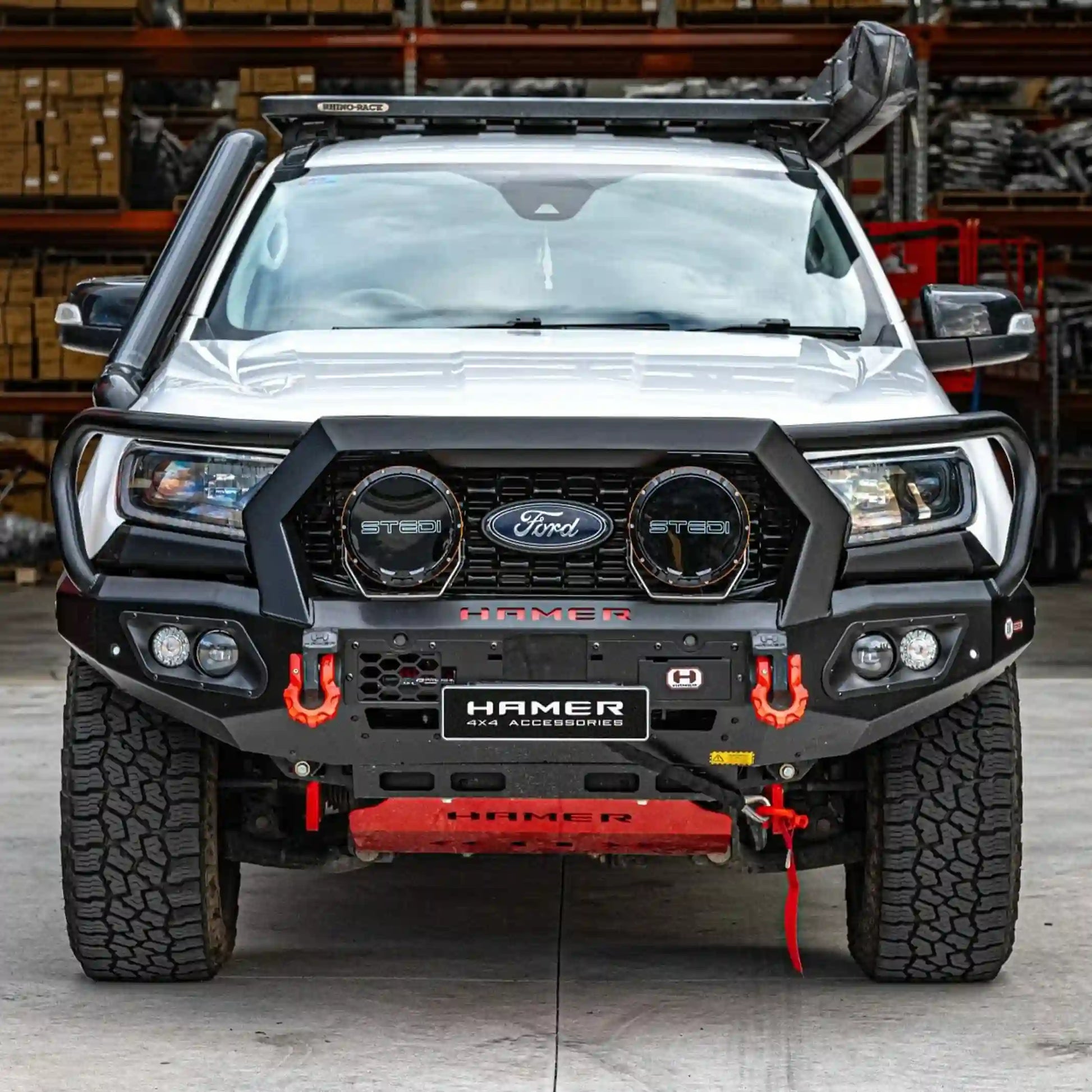Front installed view of the Hamer King Series Plus Bull Bar on a Ford Everest (2015–2022) by Elevated 4x4 in Australia. This premium off-road accessory features ADR-compliant 3 mm high-grade steel, European-certified LED lighting, winch compatibility, and a sleek matte black powder coat, delivering superior protection and style while maintaining integration with factory parking sensors and radar modules.