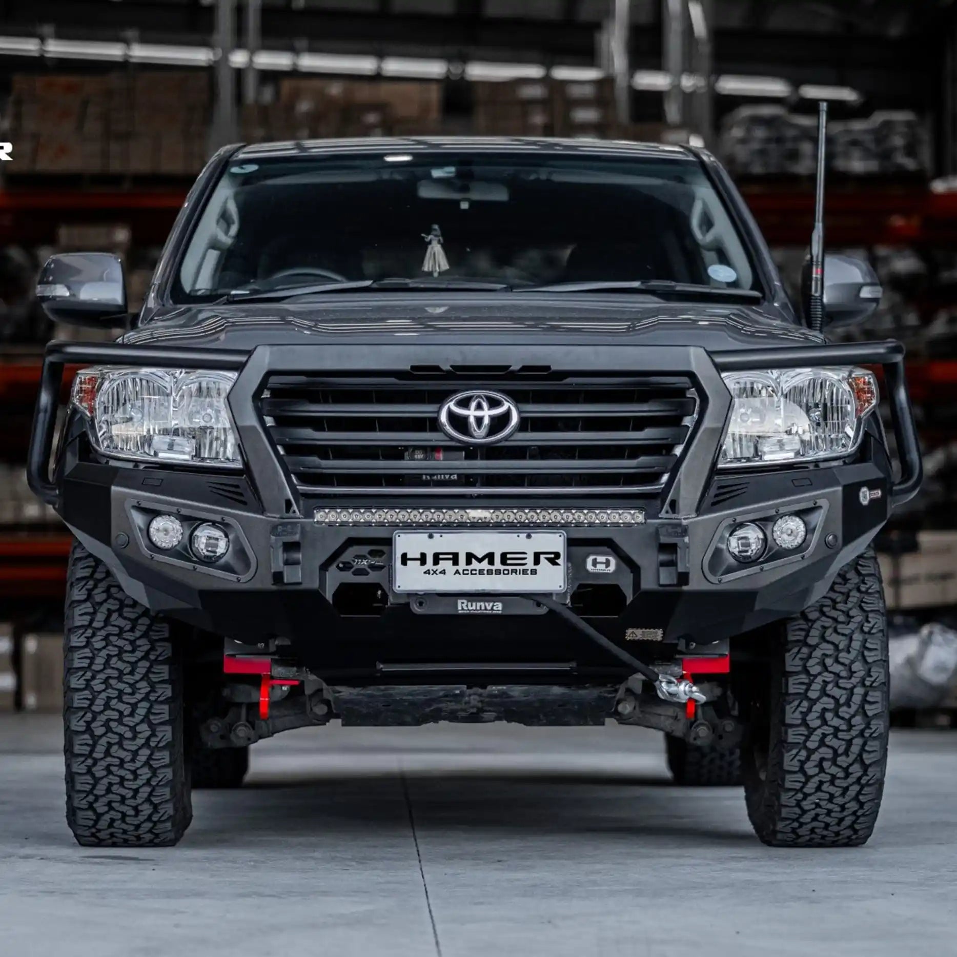 Angled front display of Landcruiser 200 Series (2008–2015) Hamer King Plus Bull Bar, featuring winch compatibility and integrated LED lighting.