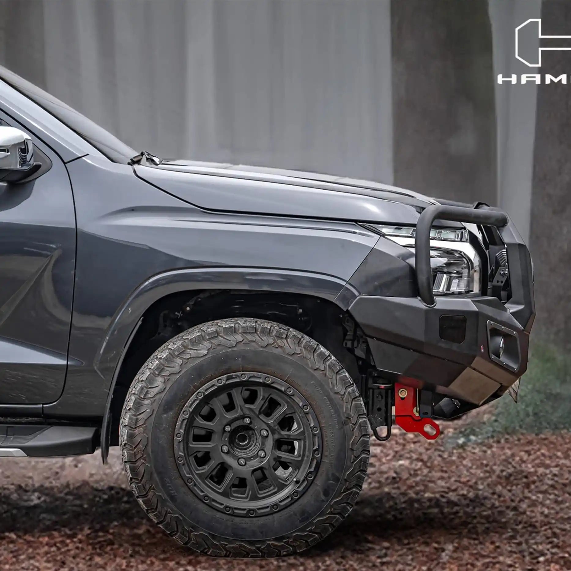Left side view of Triton MV 2024 fitted with Hamer King Plus Bull Bar, sleek matte black design with parking sensor and winch compatibility.