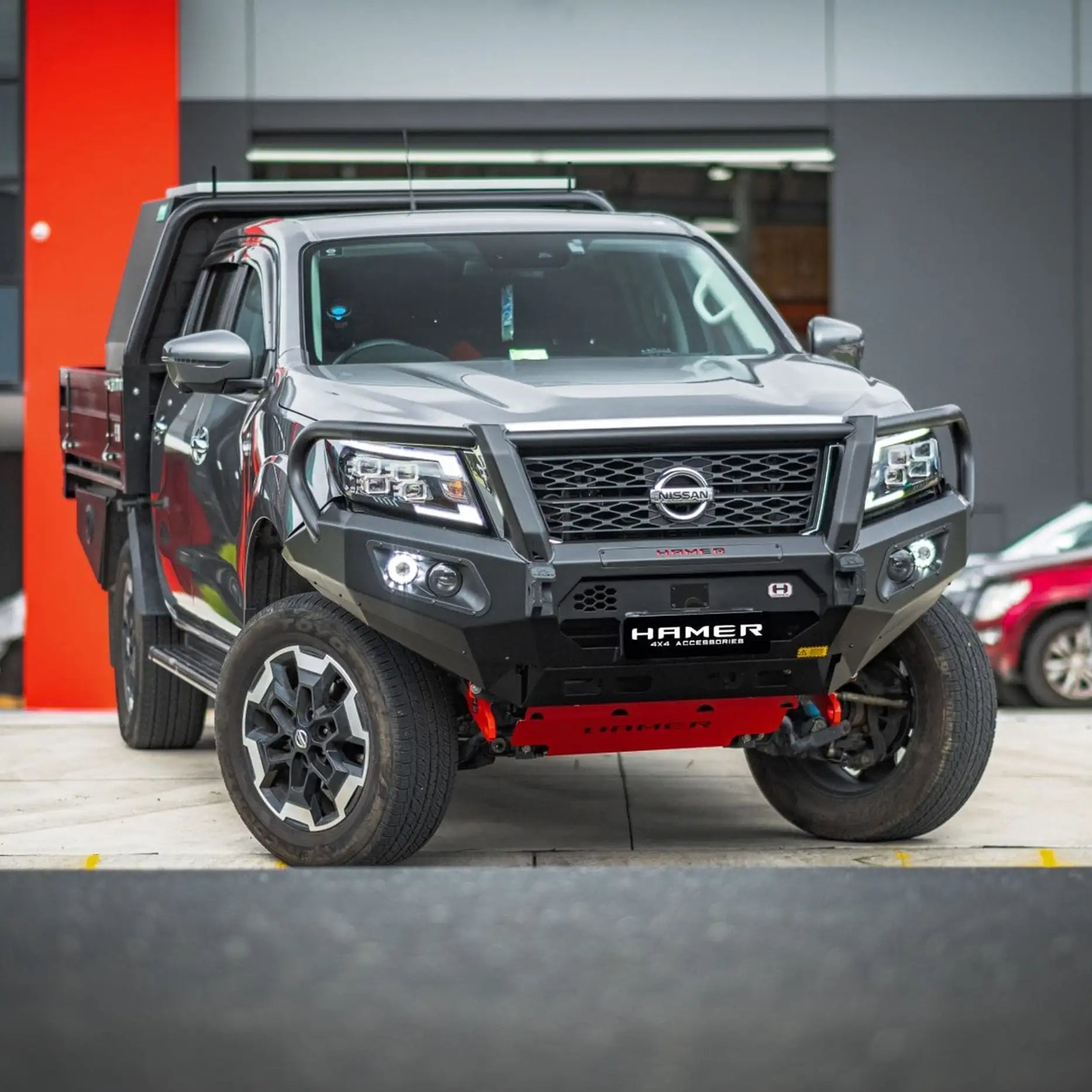 Left side view of Nissan Navara 2021 with Hamer King Plus Bull Bar, sleek integrated design with recovery points and parking sensor support.