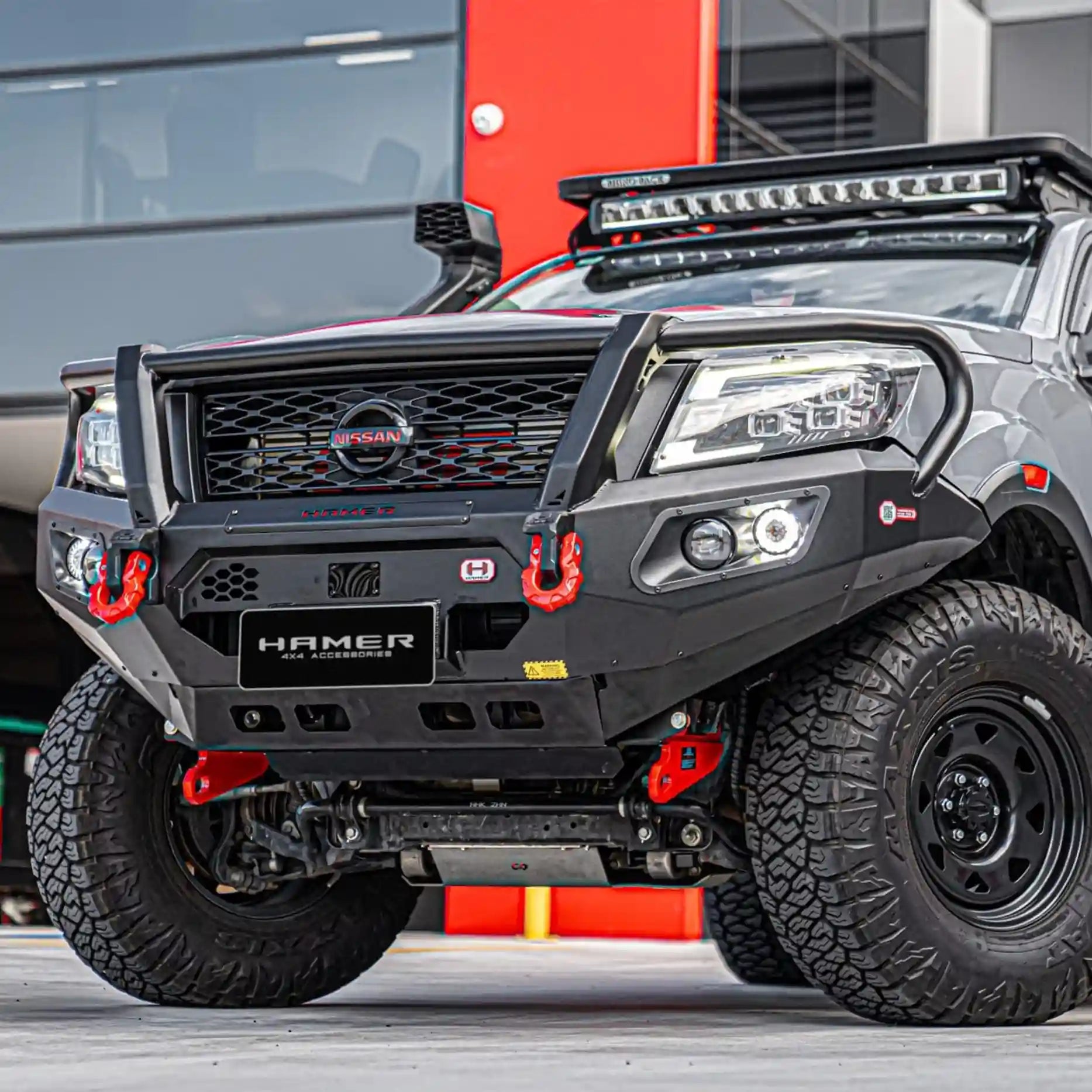 Right side angle of Nissan Navara 2021 showcasing Hamer King Plus Bull Bar, durable matte black steel construction with E-Mark LED lighting.