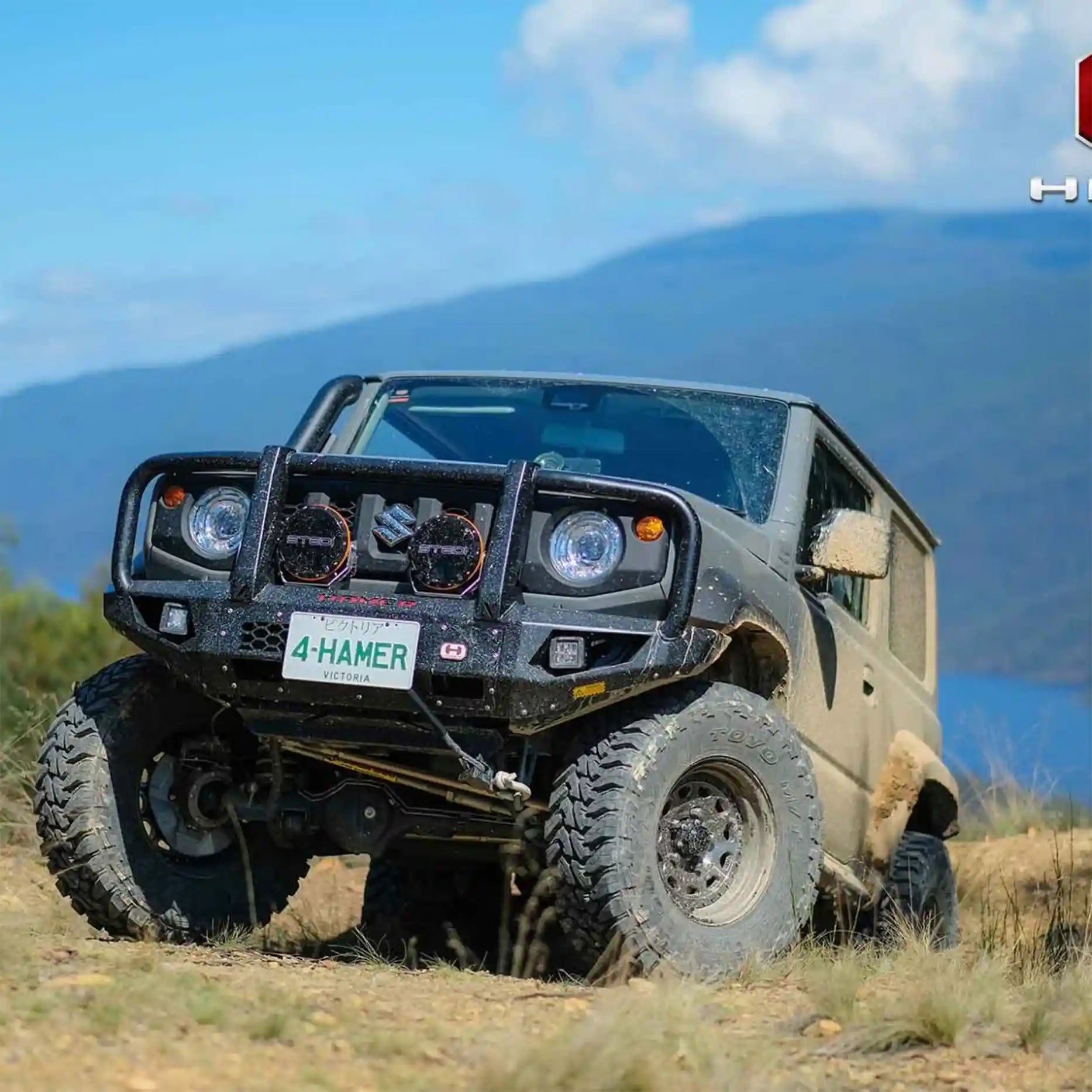 Right side angle of Suzuki Jimny JB74W with Hamer King Plus Bull Bar, strong matte finish bumper replacement offering safety and style.