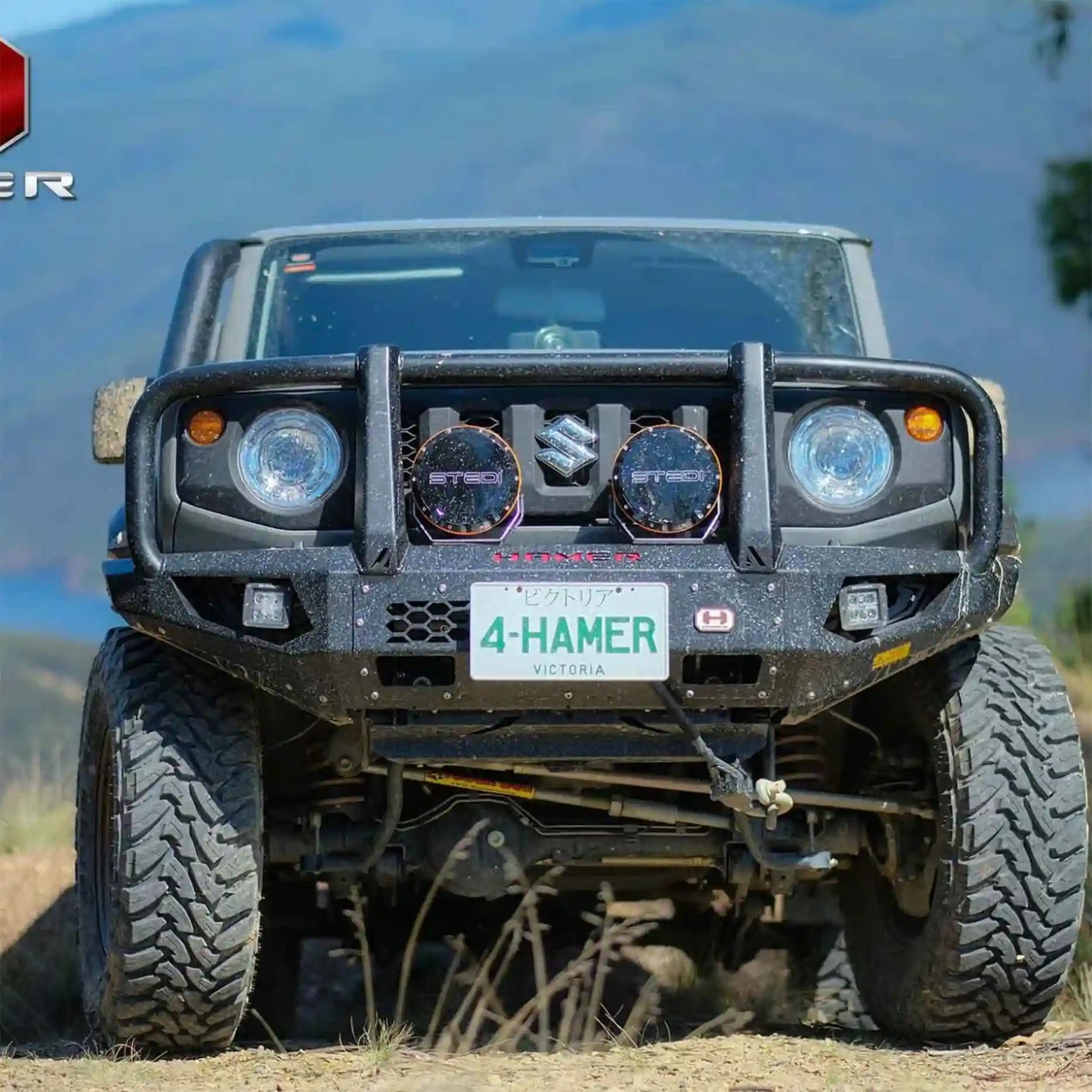 Angled front shot of Jimny XL JB74W fitted with Hamer King Plus Bull Bar, rugged bumper replacement with integrated LED work lights.