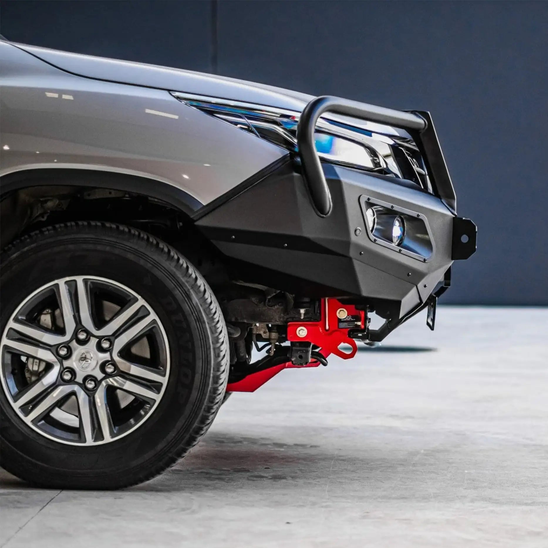 Left side view of Toyota Fortuner fitted with Hamer King Plus Bull Bar, tough steel build with parking sensor compatibility.